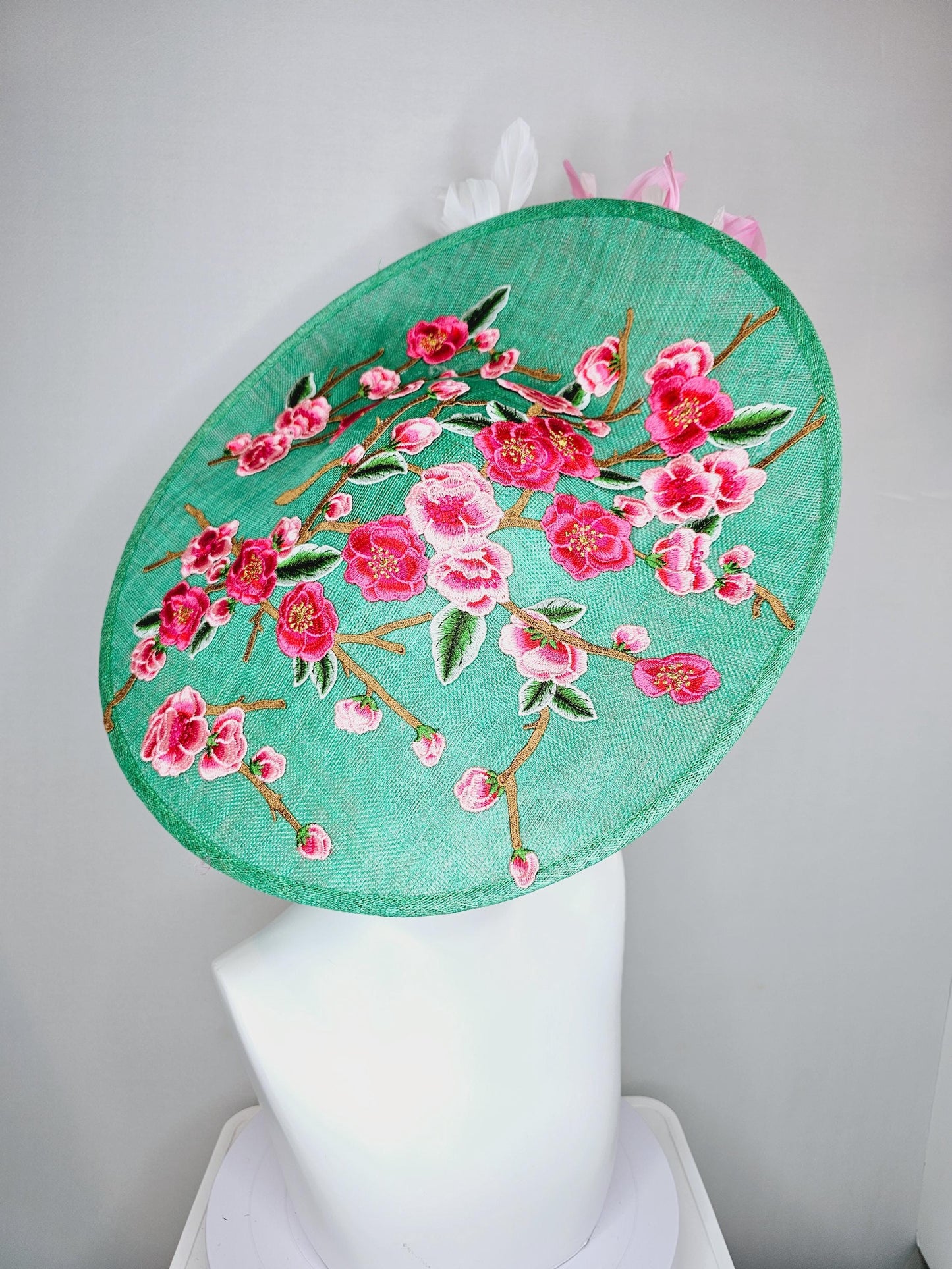 kentucky derby hat fascinator large mint green sinamay saucer with pink red green brown embroidered flowers, blush pink and white feathers