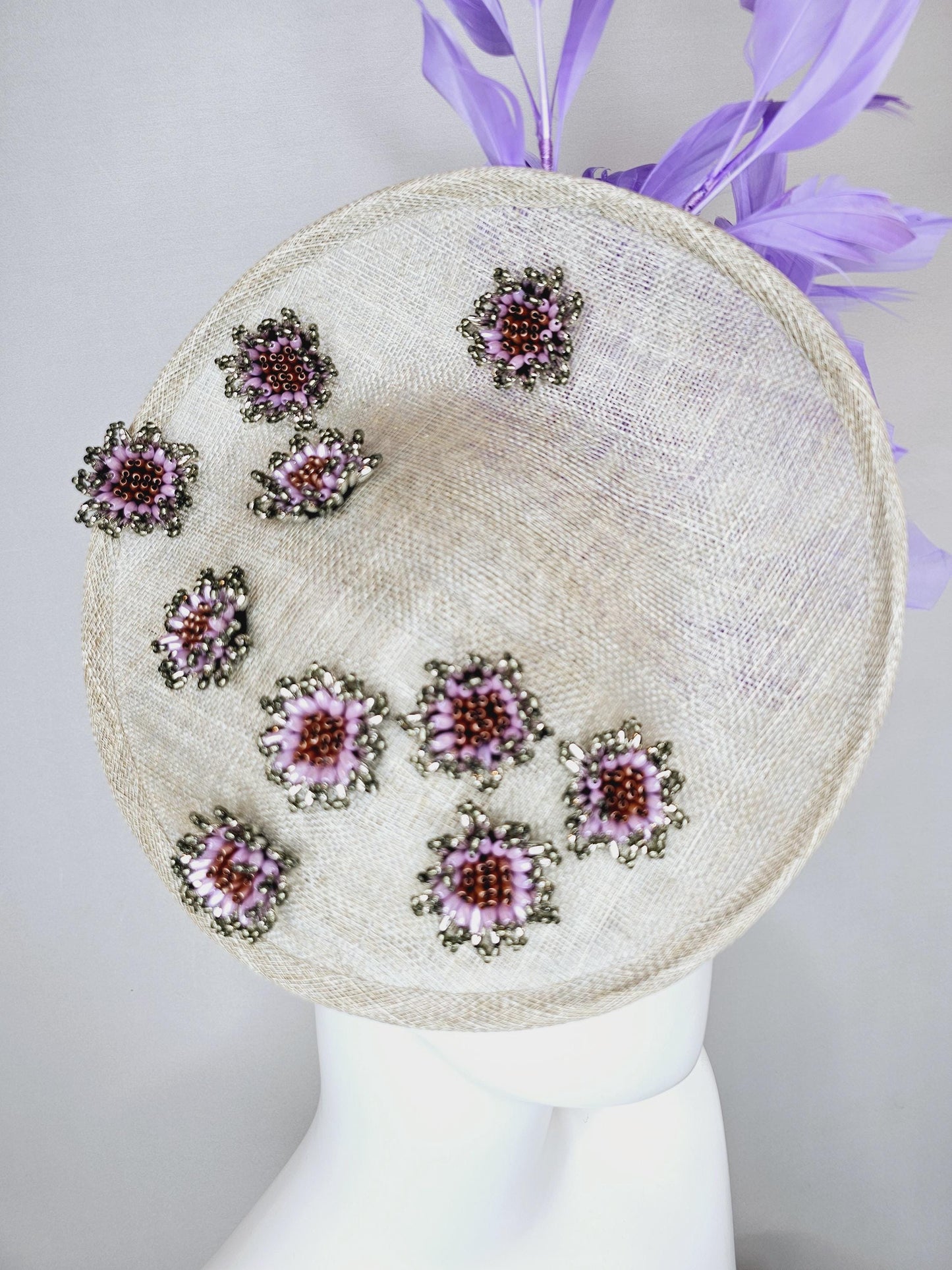 kentucky derby hat fascinator light gray sinamay saucer with silver lilac cooper crystal jewel beaded flowers and lavender purple feathers