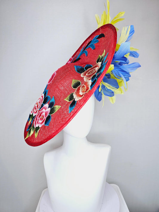 kentucky derby hat fascinator large red sinamay saucer with pink orange blue green embroidered flowers, cobalt blue and yellow feathers