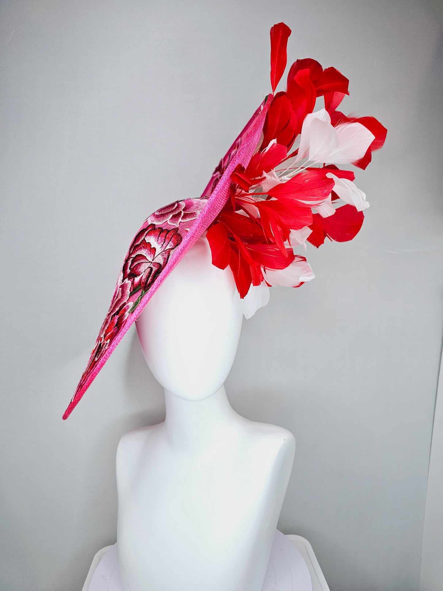 kentucky derby hat fascinator hot pink large saucer with red,pink,white embroidered flowers,green leaves,red and white branching feathers