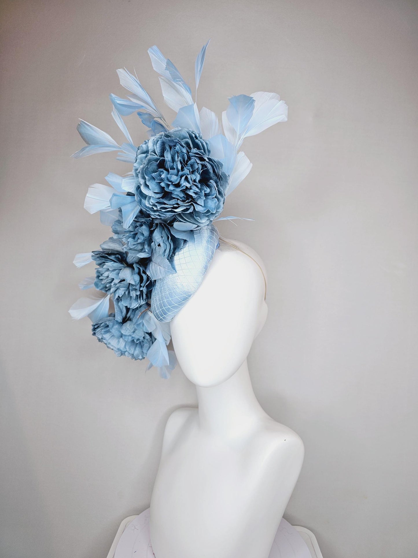 kentucky derby hat fascinator light blue satin with netting,satin silk large cerulean blue flowers,blue leaves and light baby blue feathers