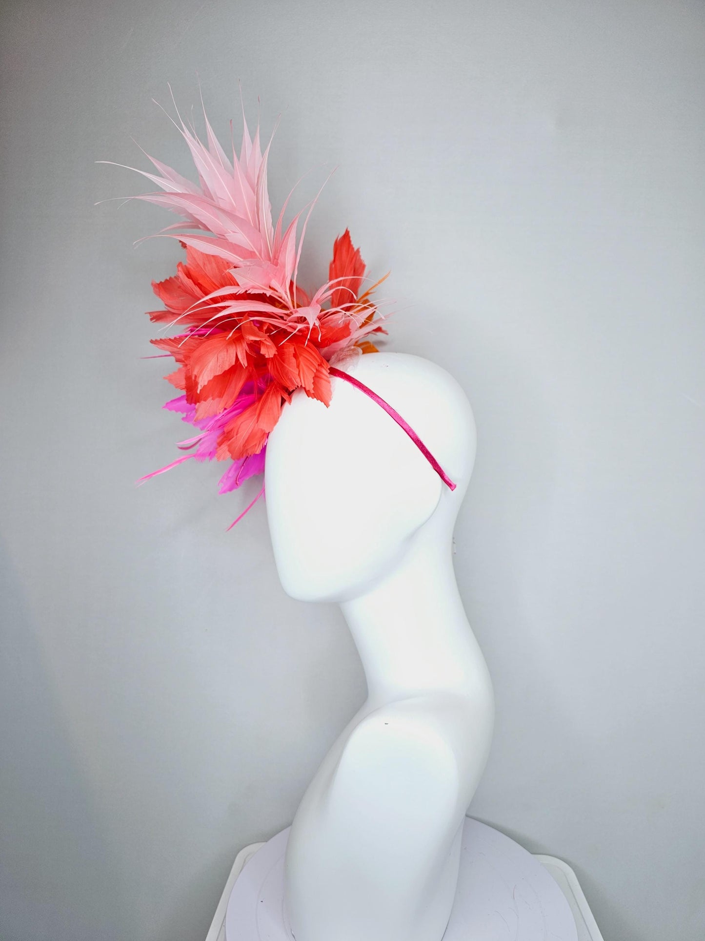 kentucky derby hat fascinator bright hot pink fluffy feather flower with coral orange branching feathers and light pink pointy feathers