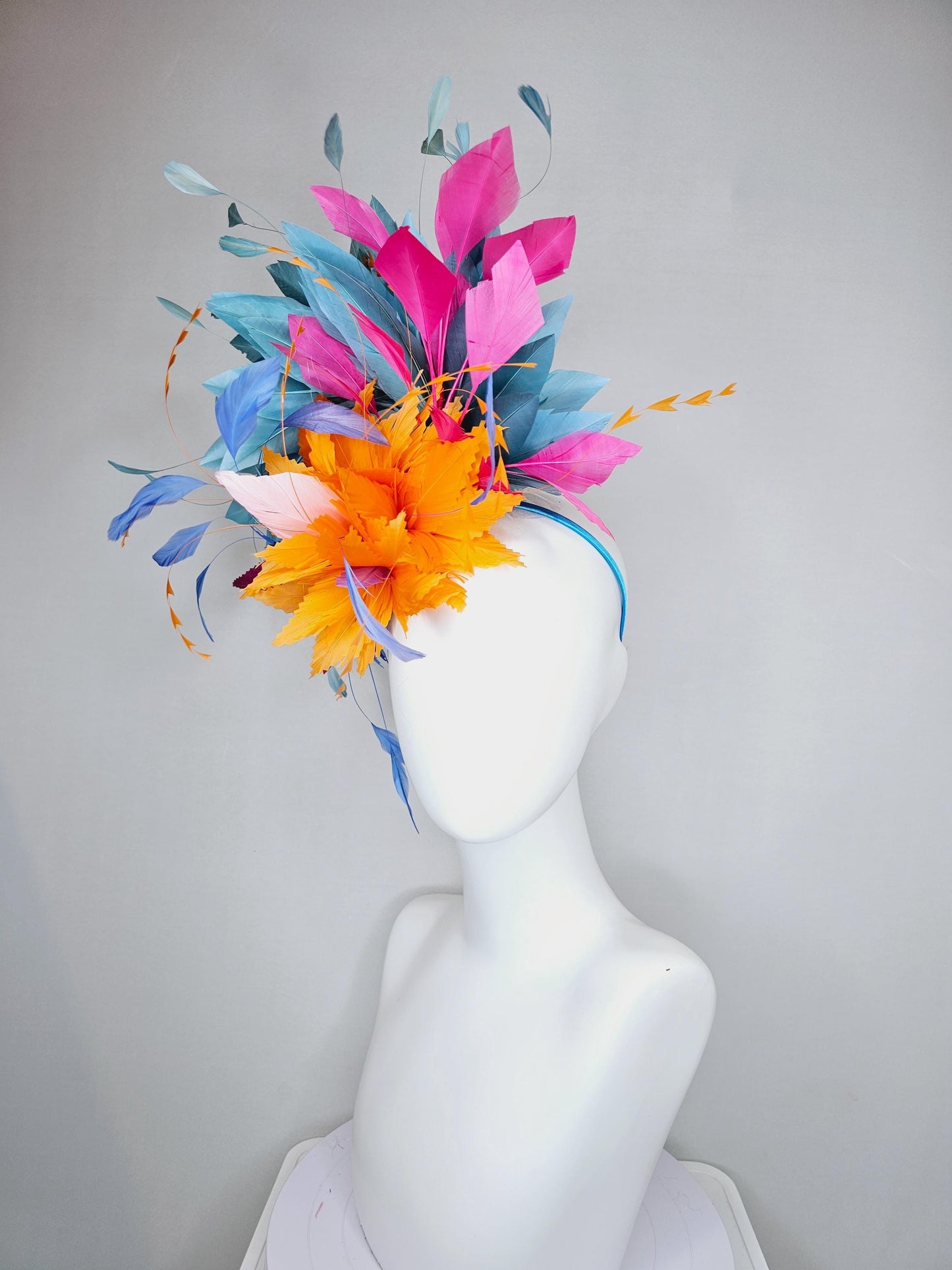 kentucky derby hat fascinator tangerine orange feather flower with colorful pink,blue teal,and cobalt blue branching feathers