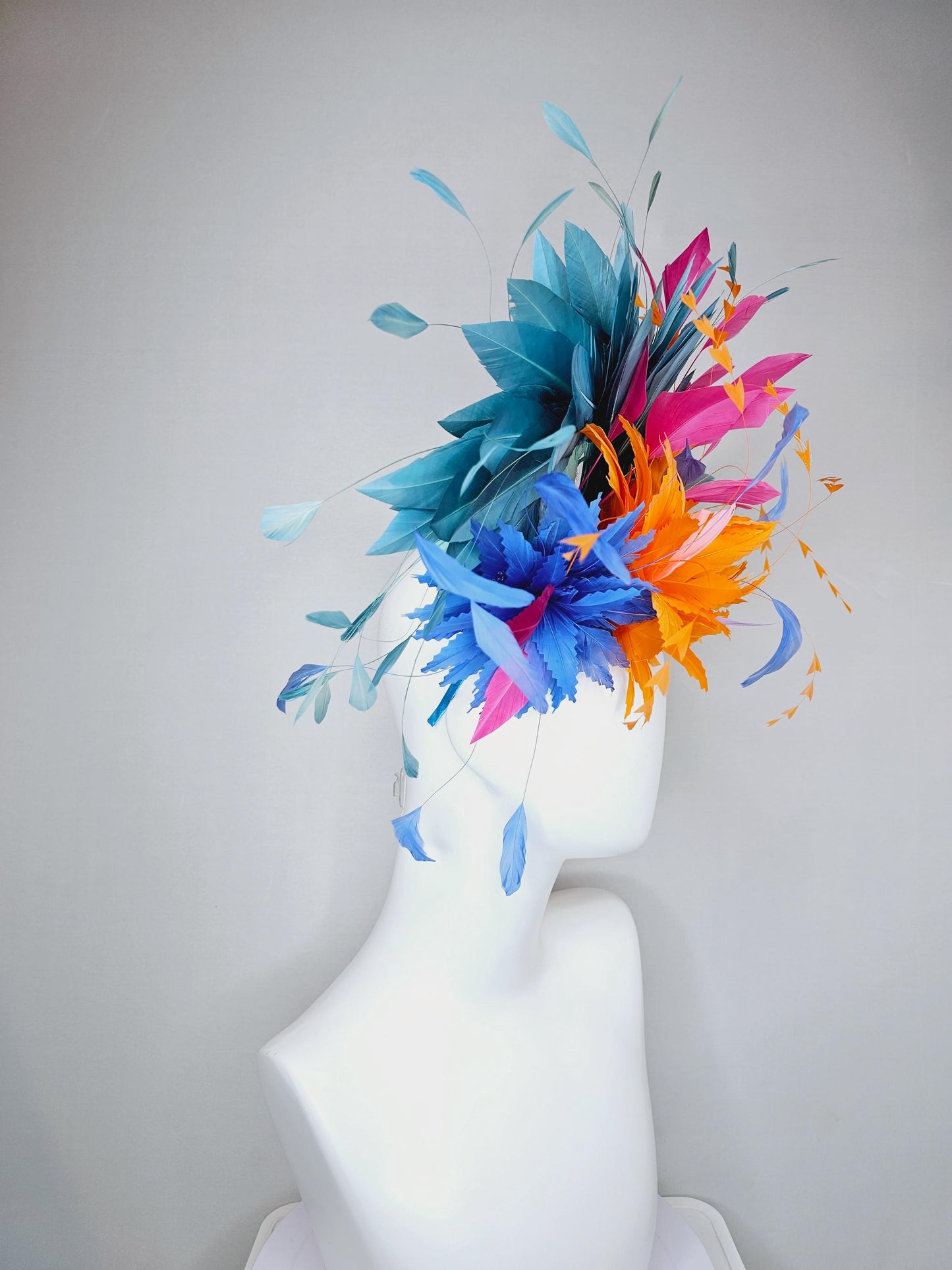 kentucky derby hat fascinator tangerine orange feather flower with colorful pink,blue teal,and cobalt blue branching feathers