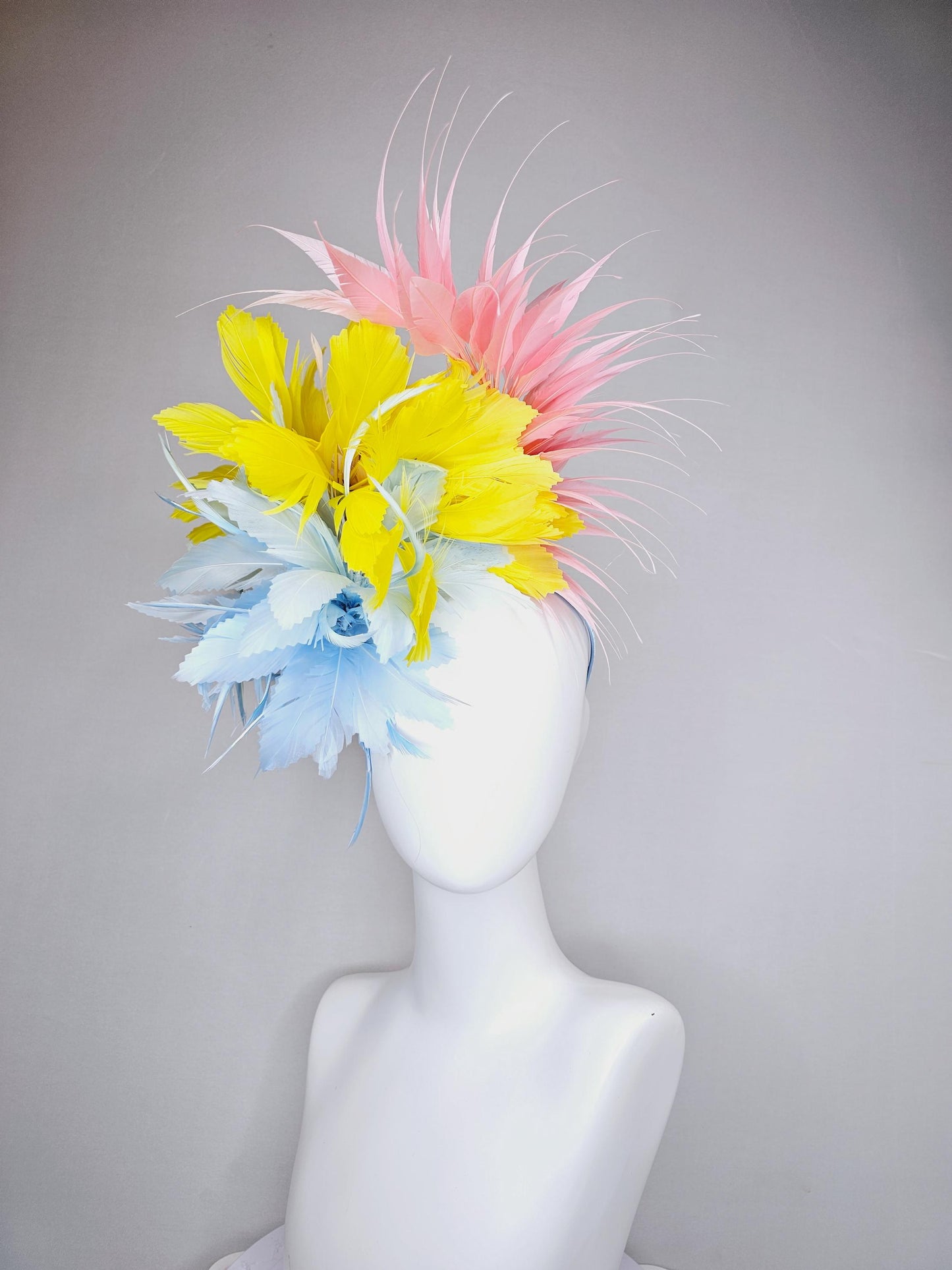 kentucky derby hat fascinator light blue fluffy zigzag feather flower with bright yellow branching feathers and light pink pointy feathers