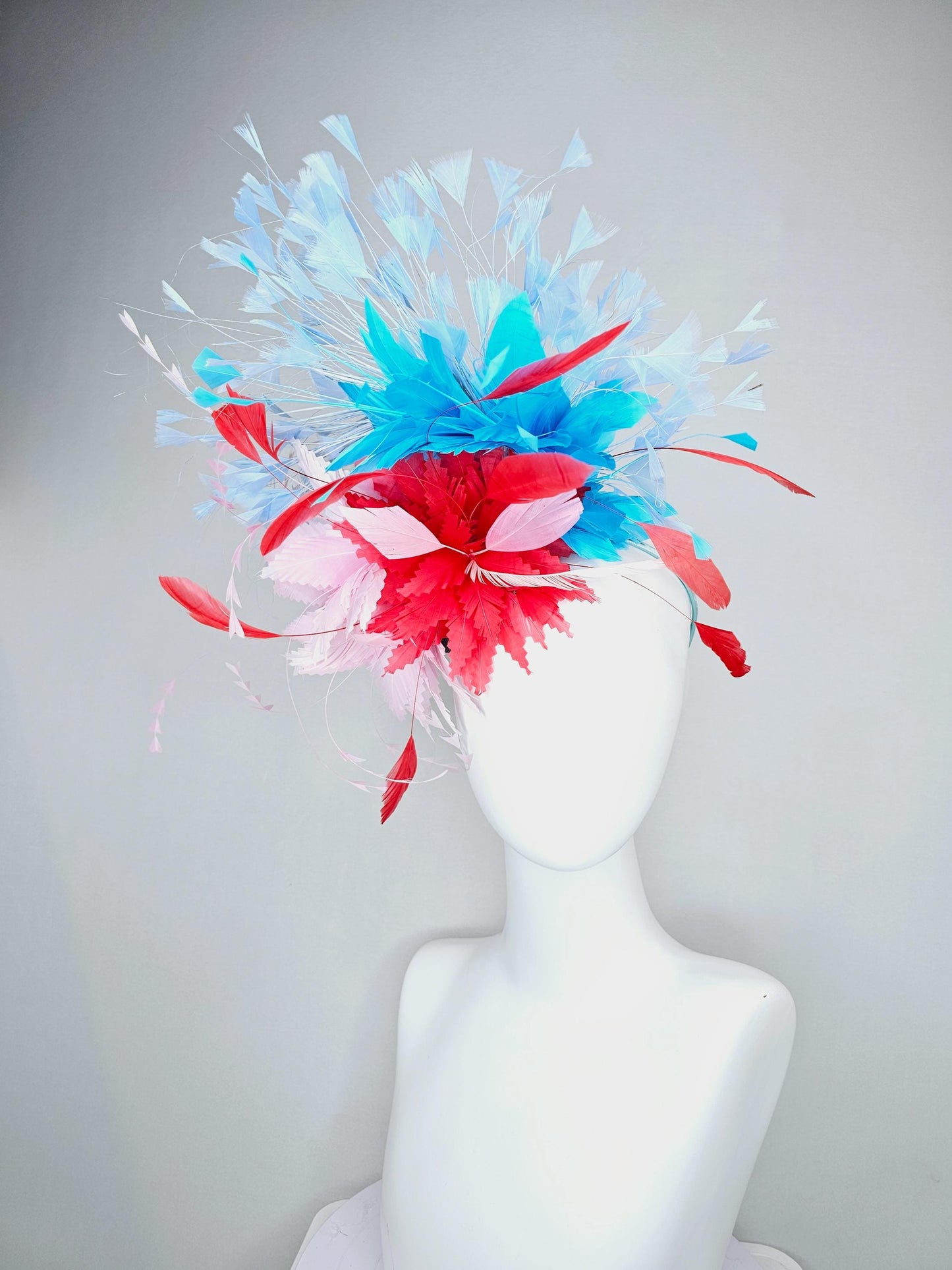 kentucky derby hat fascinator light pink and cherry red zigzag feather flowers with bright sky blue and light blue branching feathers