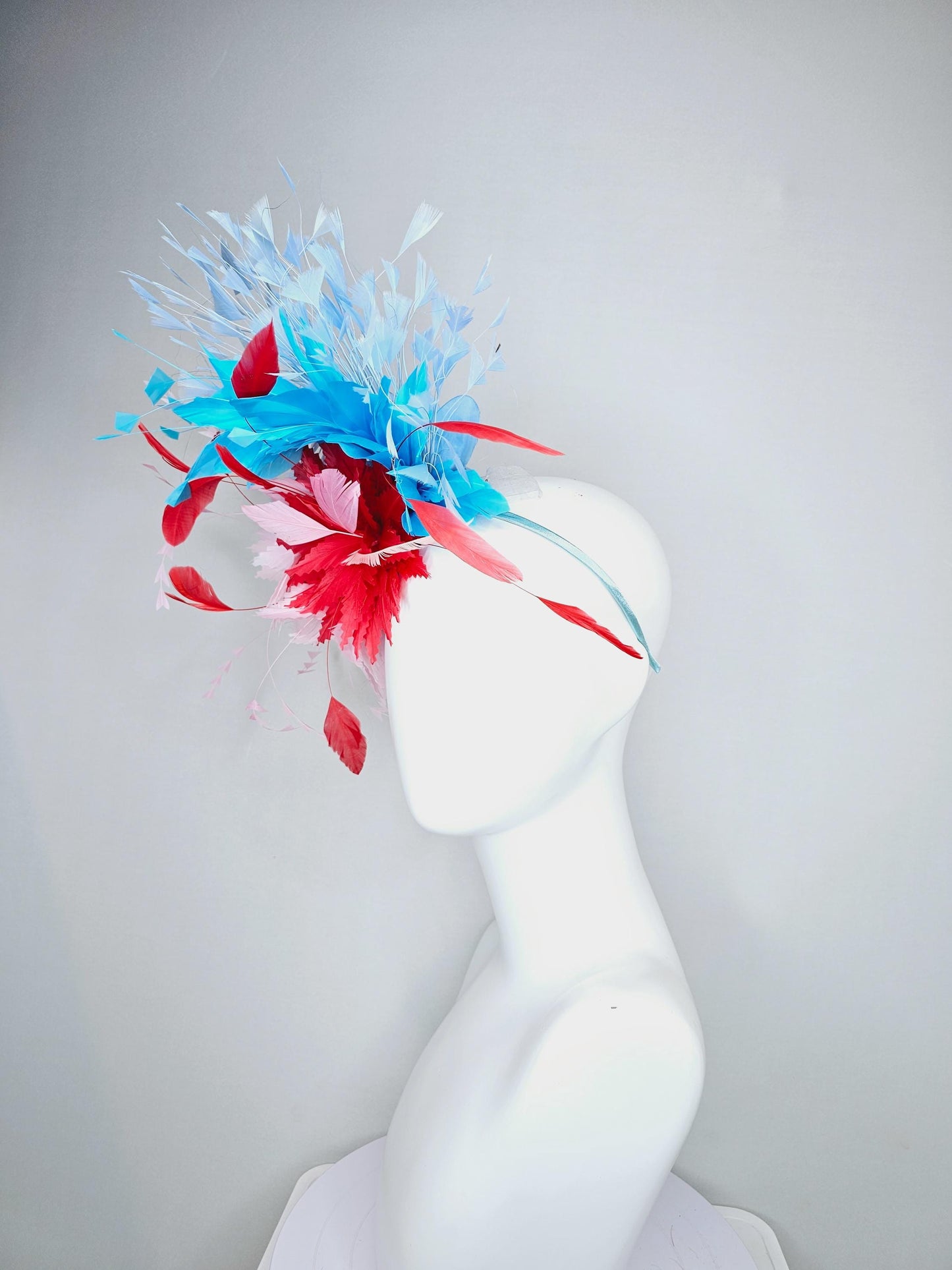 kentucky derby hat fascinator light pink and cherry red zigzag feather flowers with bright sky blue and light blue branching feathers