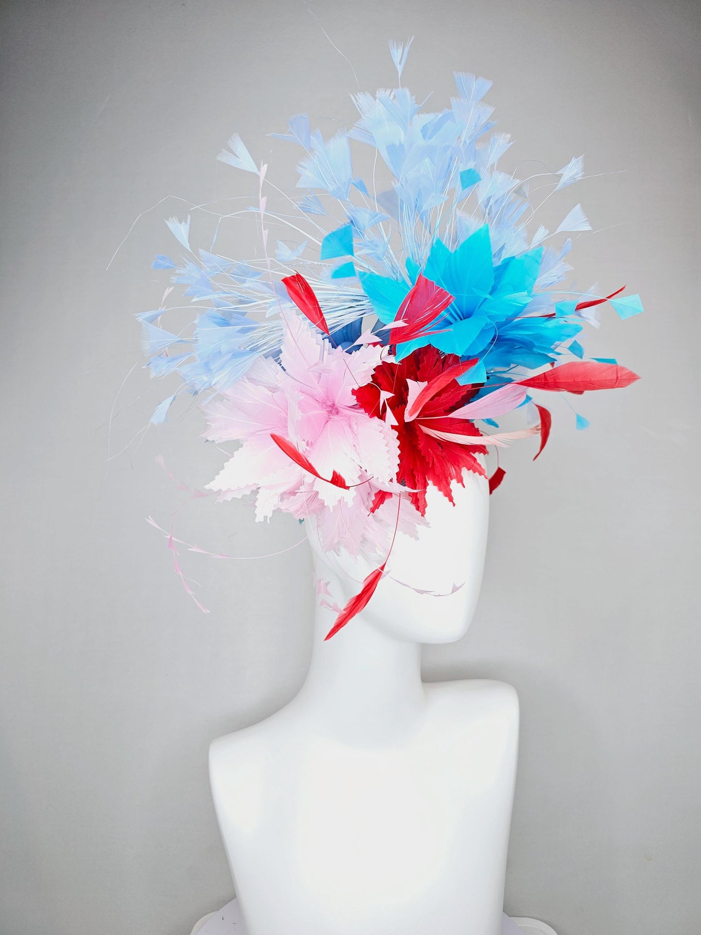 kentucky derby hat fascinator light pink and cherry red zigzag feather flowers with bright sky blue and light blue branching feathers