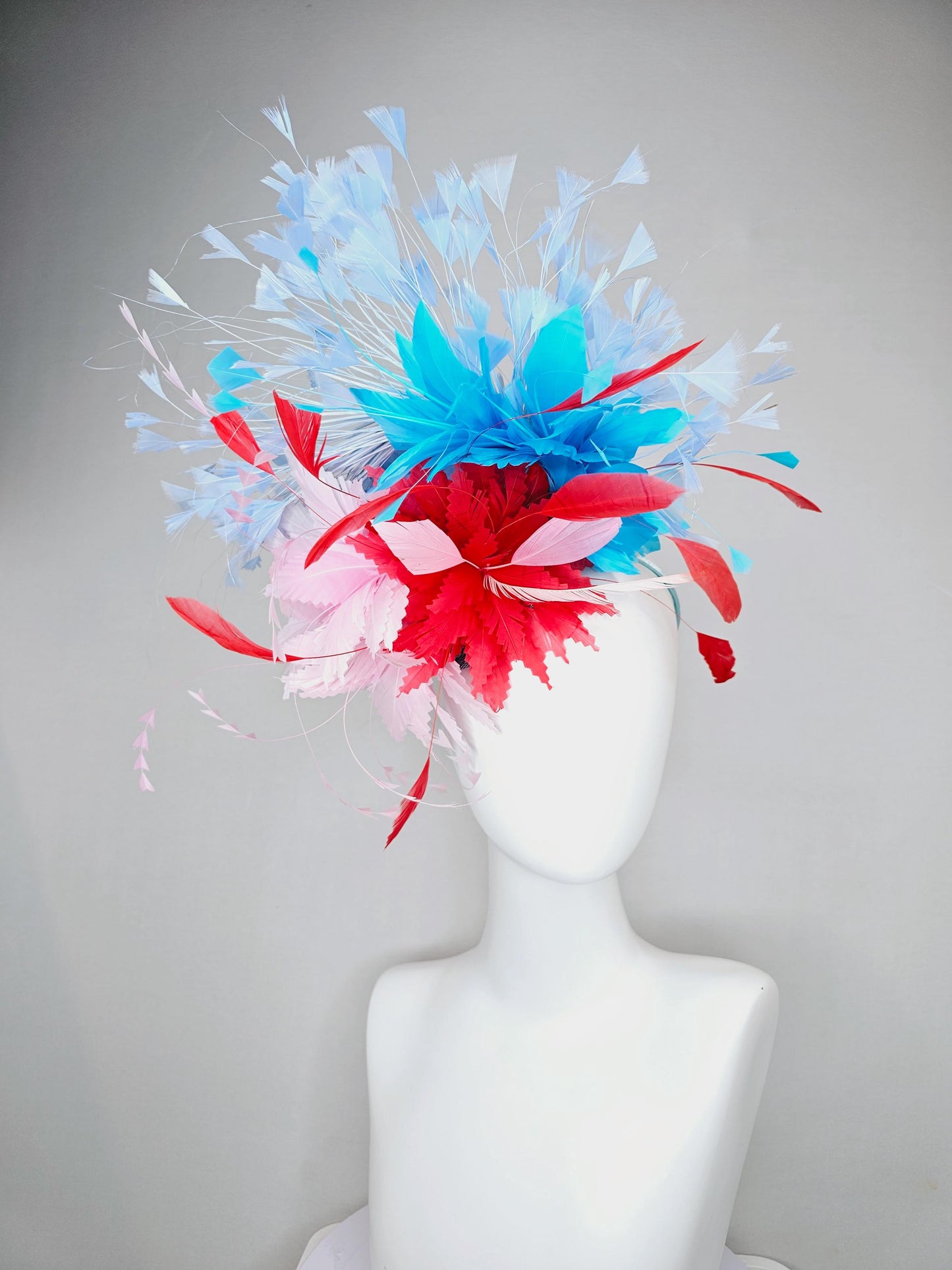 kentucky derby hat fascinator light pink and cherry red zigzag feather flowers with bright sky blue and light blue branching feathers