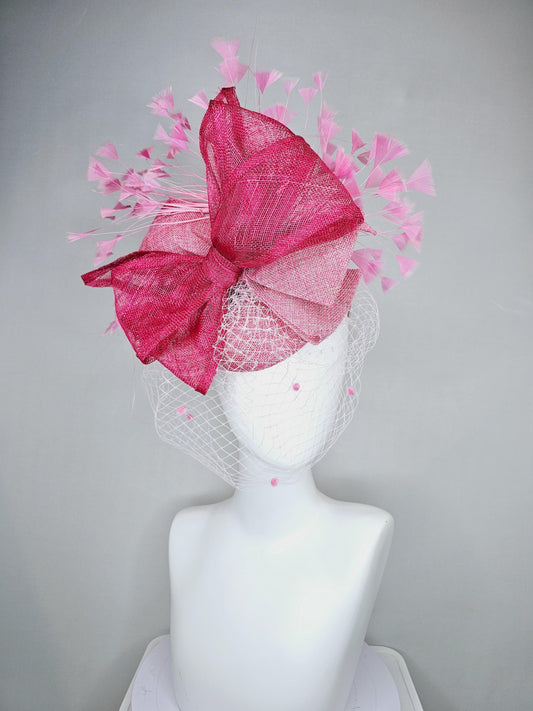 kentucky derby hat fascinator light red sinamay w/ white mesh veil, large raspberry red mesh ribbon bow decor, blush pink branching feathers