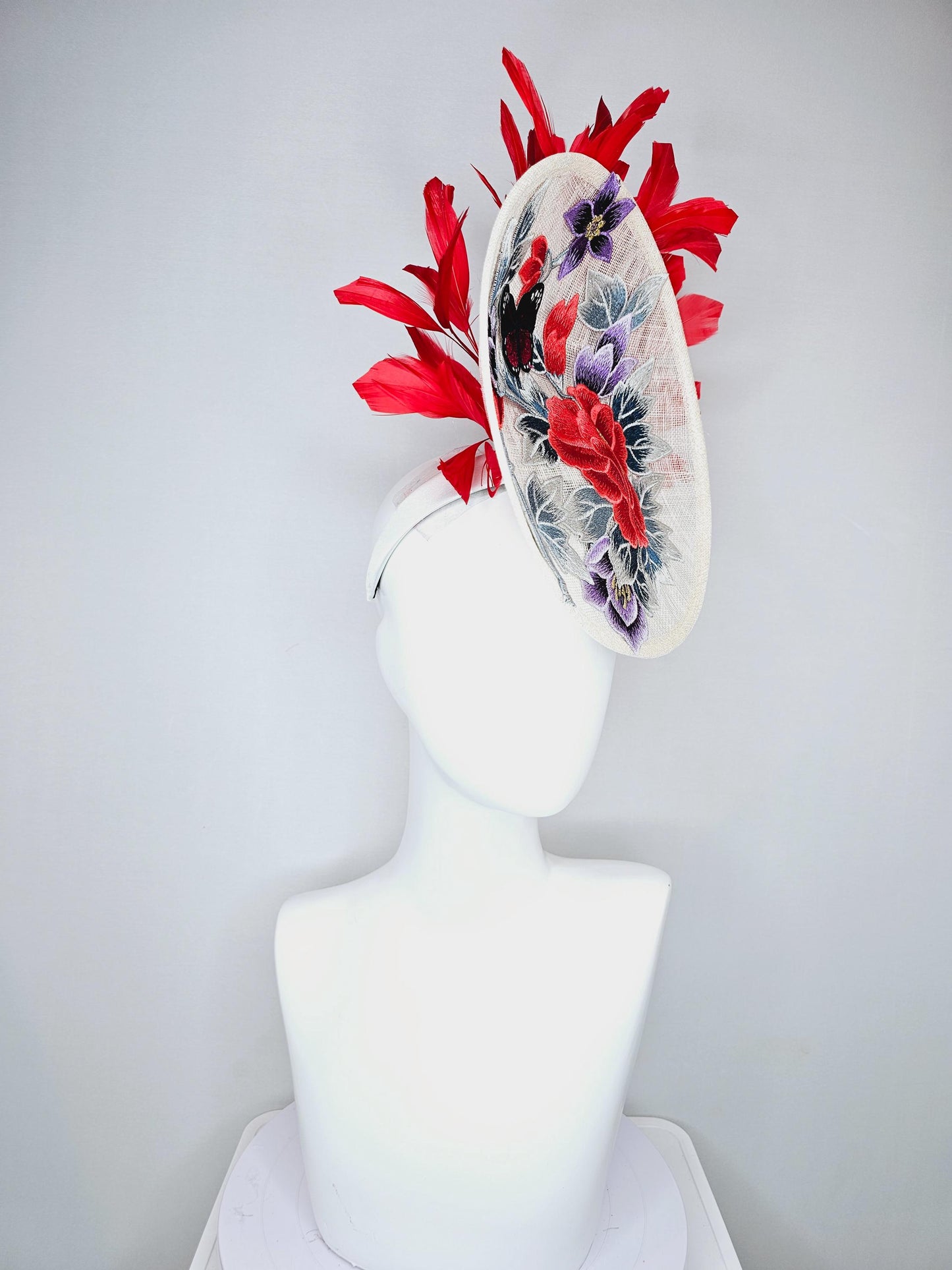 kentucky derby hat fascinator white sinamay saucer with red blue purple black embroidered flowers butterfly, scarlet red branching feathers