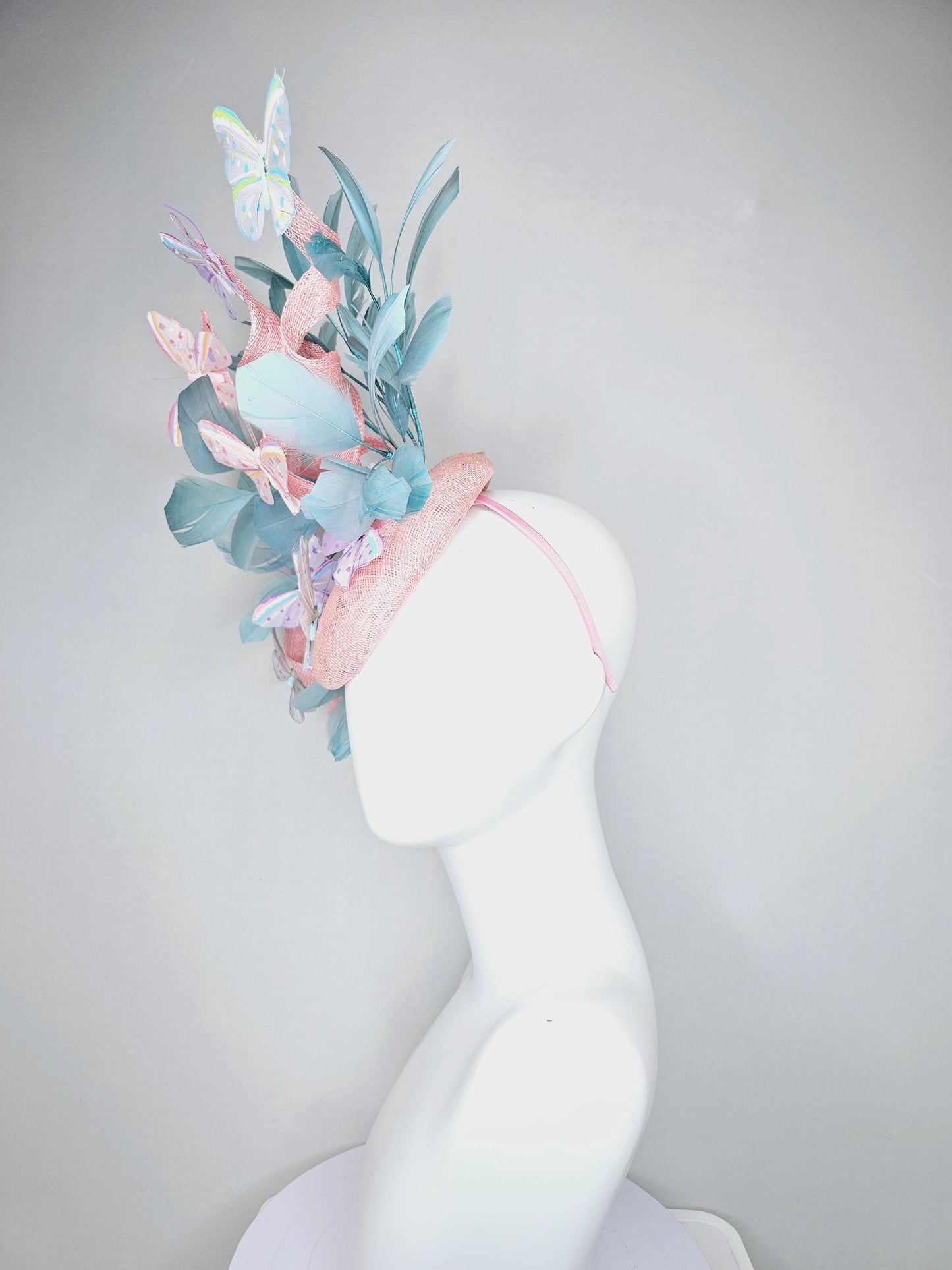 kentucky derby hat fascinator light baby pink sinamay with curls,light blue branching feathers,ivory,pink,purple,yellow,blue butterflies