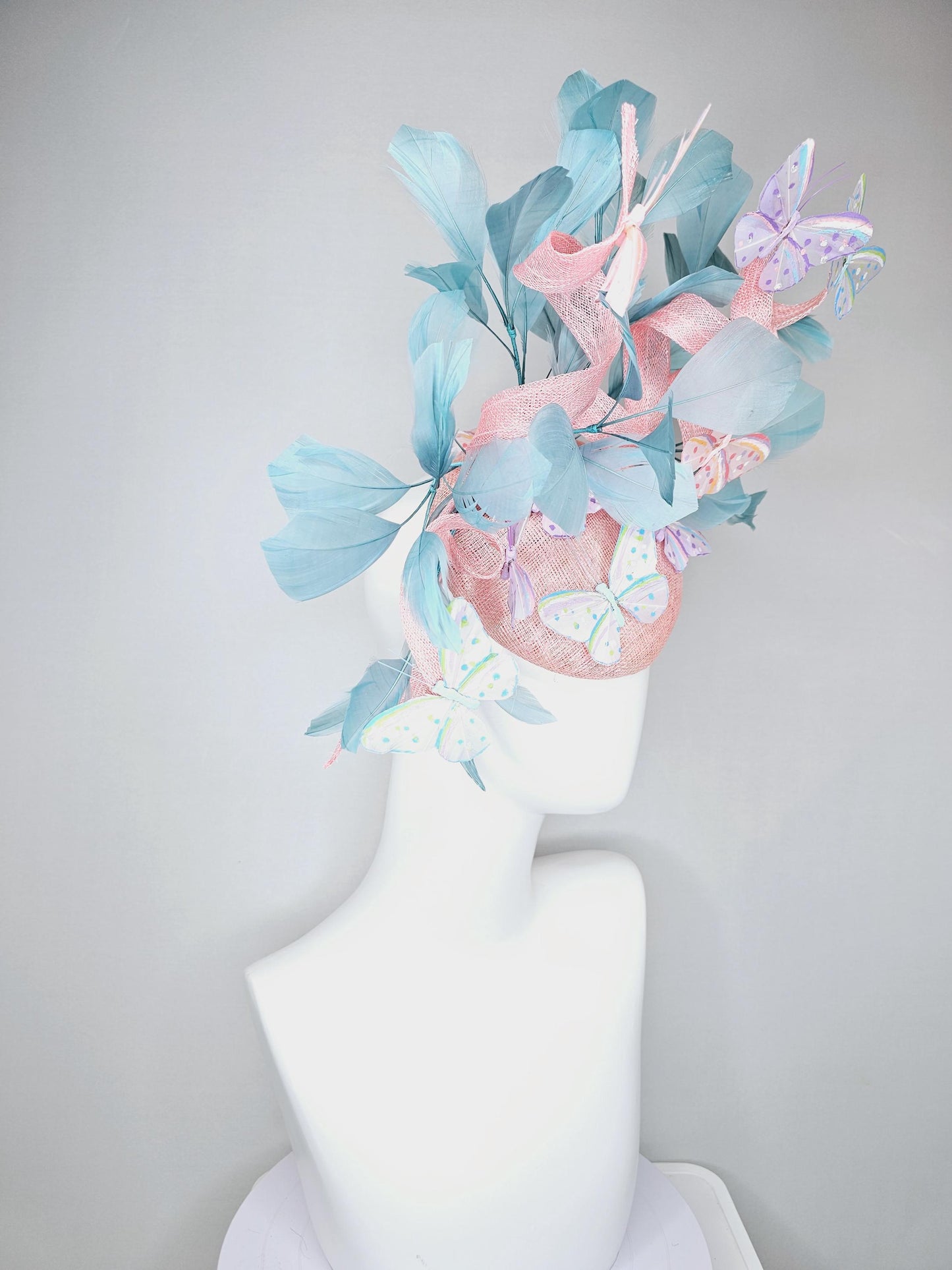 kentucky derby hat fascinator light baby pink sinamay with curls,light blue branching feathers,ivory,pink,purple,yellow,blue butterflies