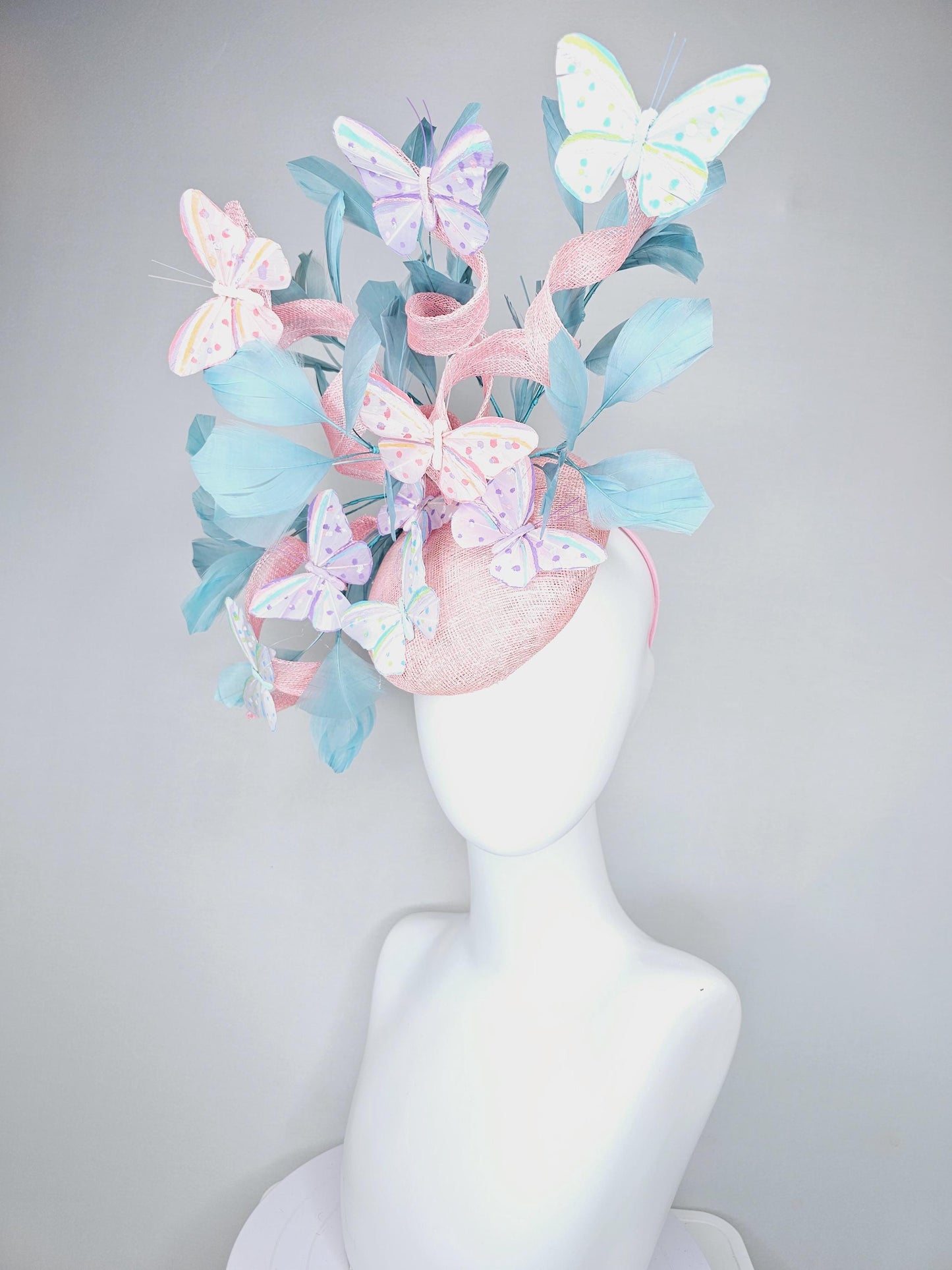 kentucky derby hat fascinator light baby pink sinamay with curls,light blue branching feathers,ivory,pink,purple,yellow,blue butterflies