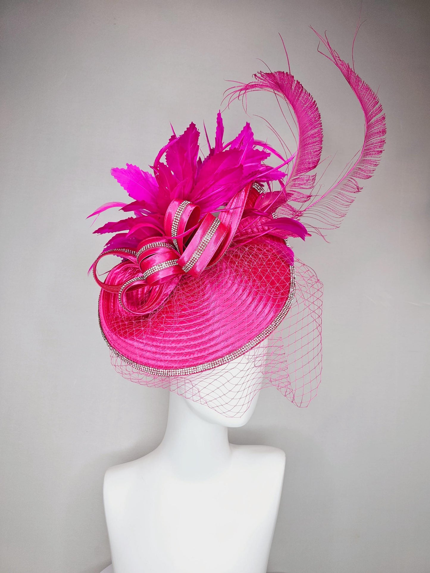 kentucky derby hat fascinator hot pink satin saucer with crystal rhinestone beading and satin beaded bow,and fuchsia pink branching feathers