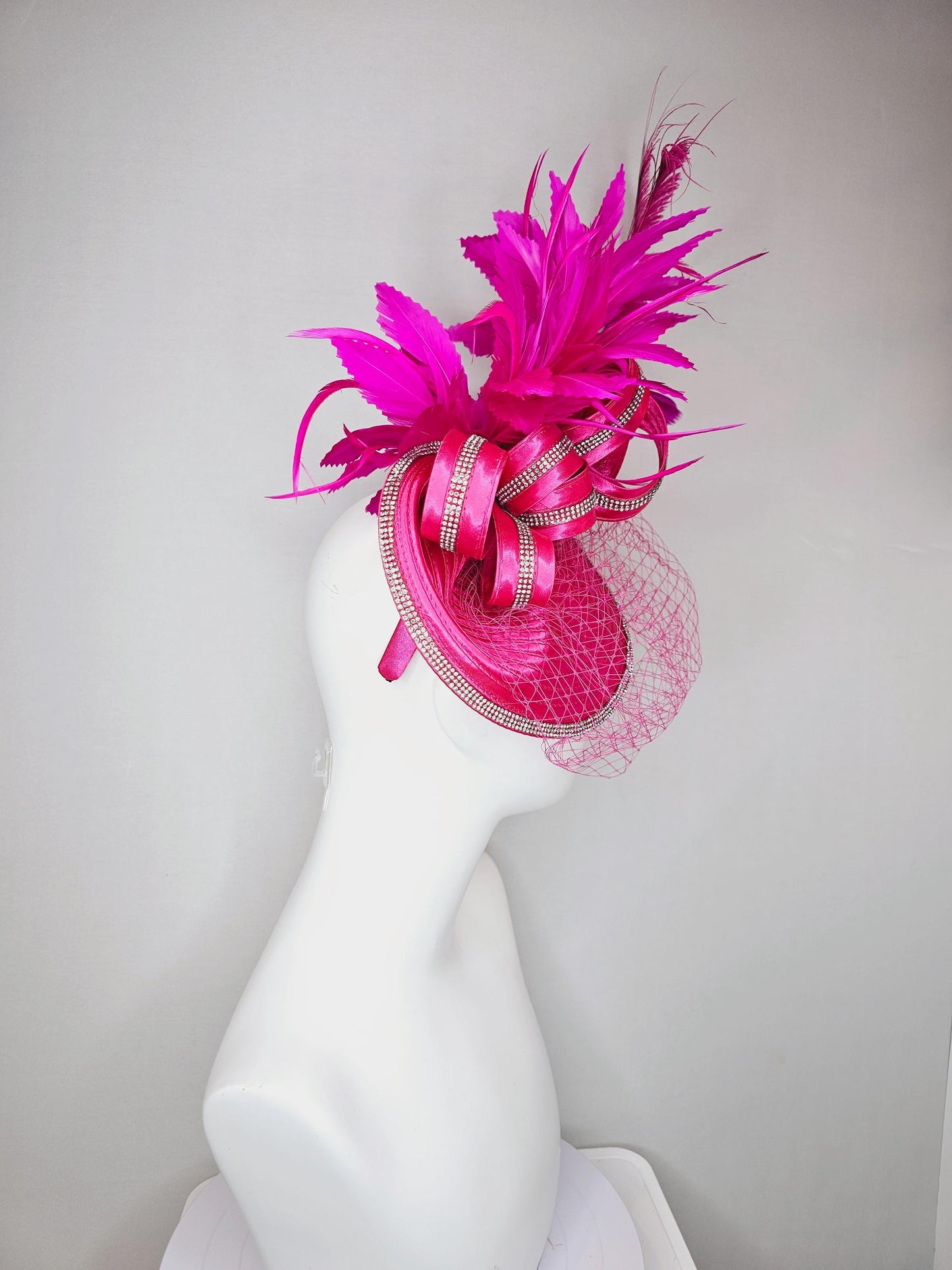 kentucky derby hat fascinator hot pink satin saucer with crystal rhinestone beading and satin beaded bow,and fuchsia pink branching feathers