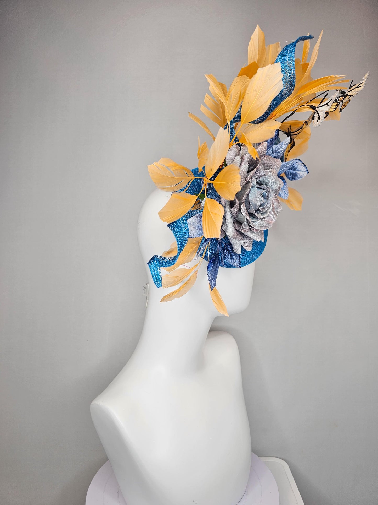 kentucky derby hat fascinator blue sinamay w/ curls,blue purple ombre rose,blue leaves,apricot orange yellow feathers w/ apricot butterflies