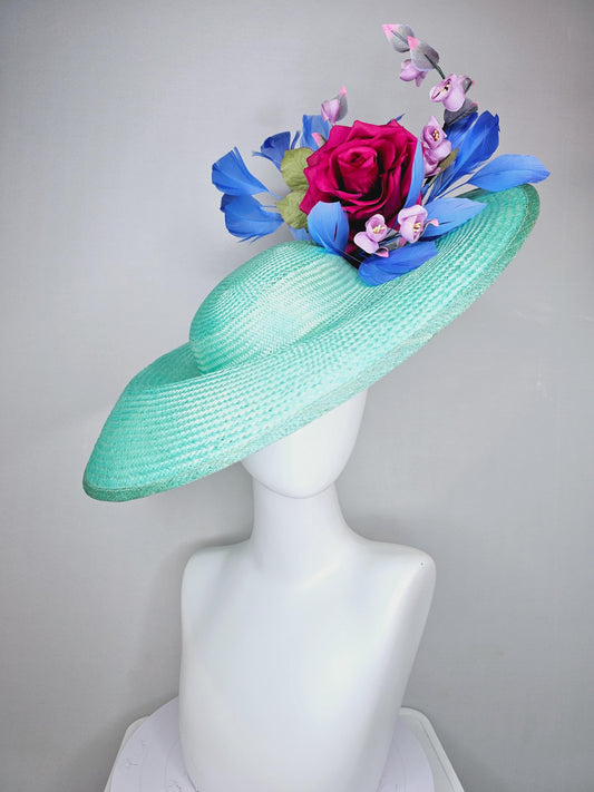 kentucky derby hat wide brim straw in aqua mint green with pink satin rose and lilac lavender purple satin rose stems cobalt blue feathers