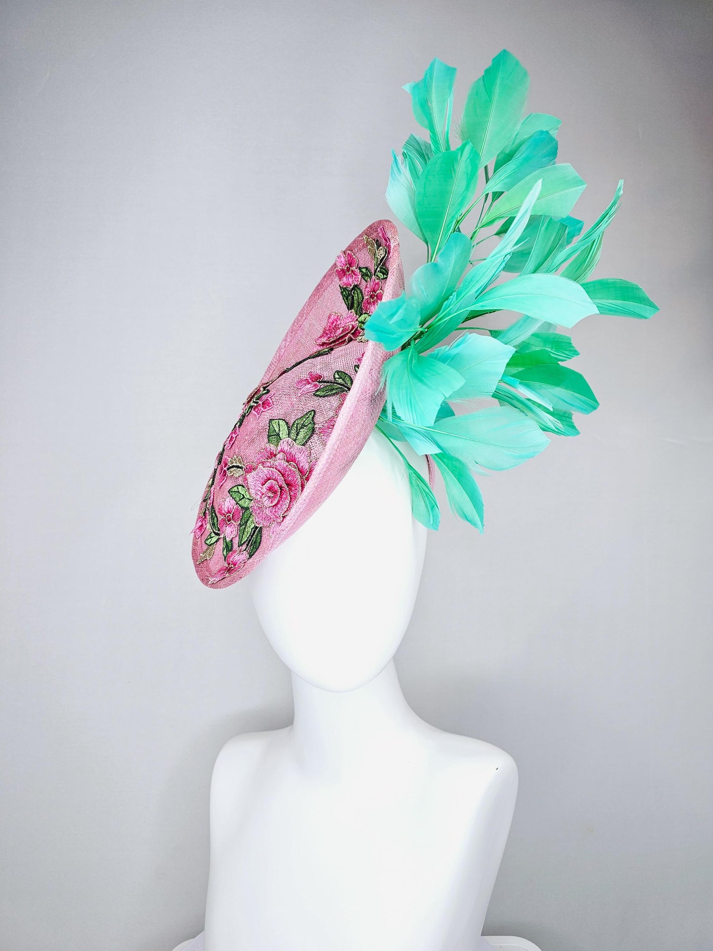 kentucky derby hat fascinator light pink sinamay saucer with pink flowers green leaves embroidered and aqua mint green branching feathers