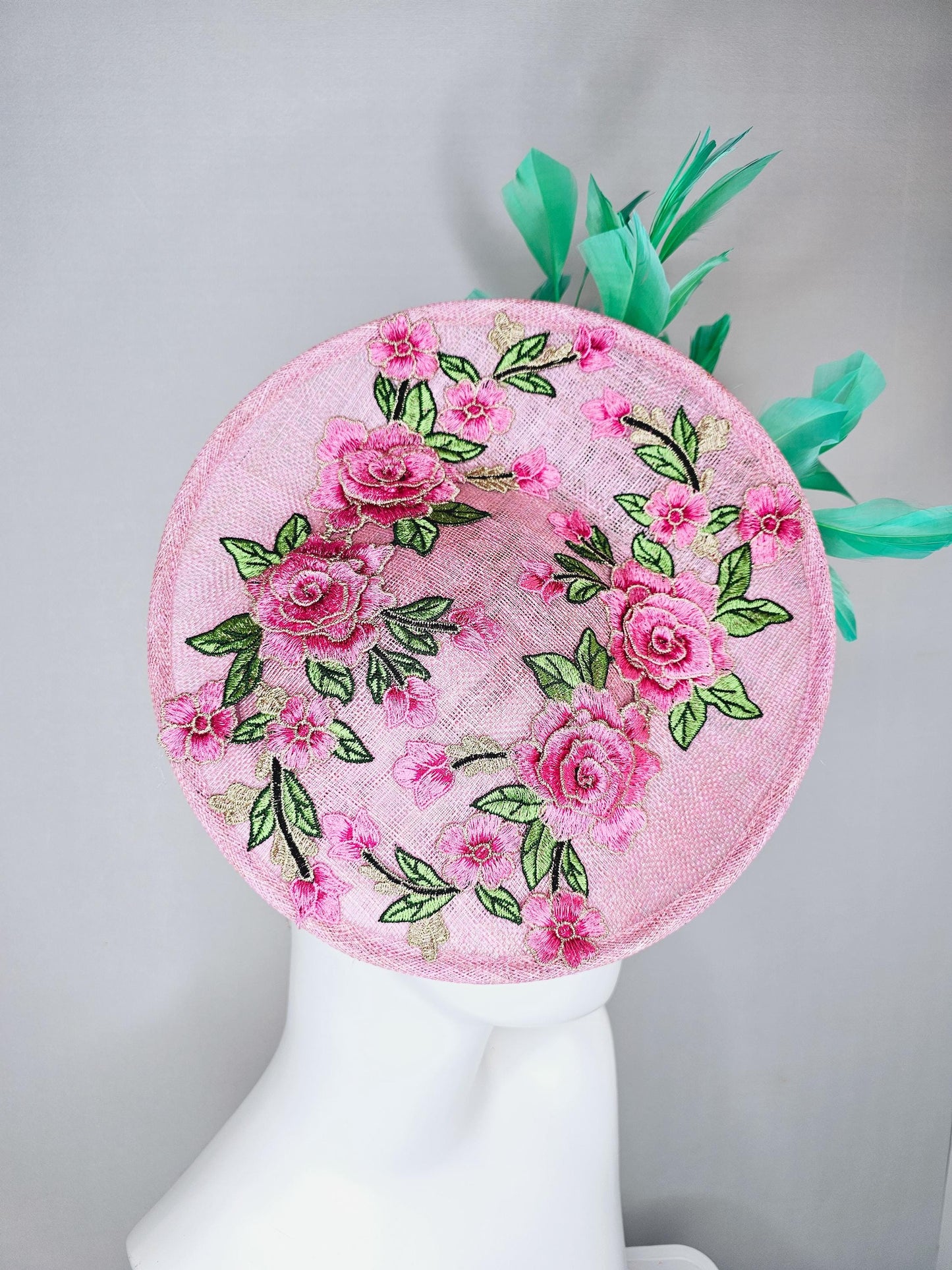 kentucky derby hat fascinator light pink sinamay saucer with pink flowers green leaves embroidered and aqua mint green branching feathers