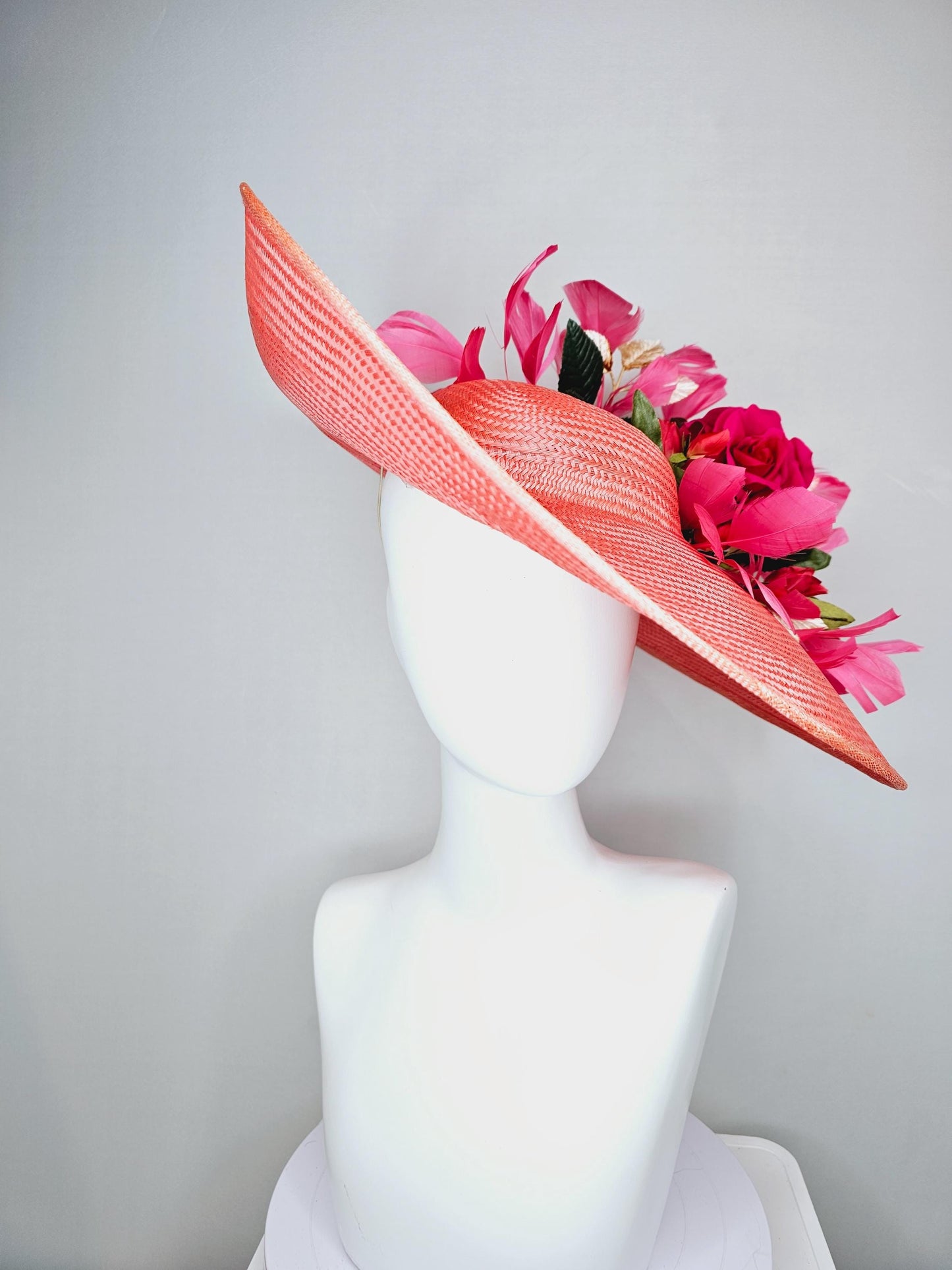 kentucky derby hat wide brim straw in coral orange with pink branching feathers hot pink satin roses green light pink gold leaves