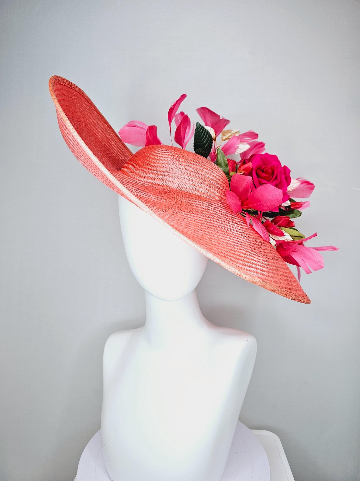 kentucky derby hat wide brim straw in coral orange with pink branching feathers hot pink satin roses green light pink gold leaves