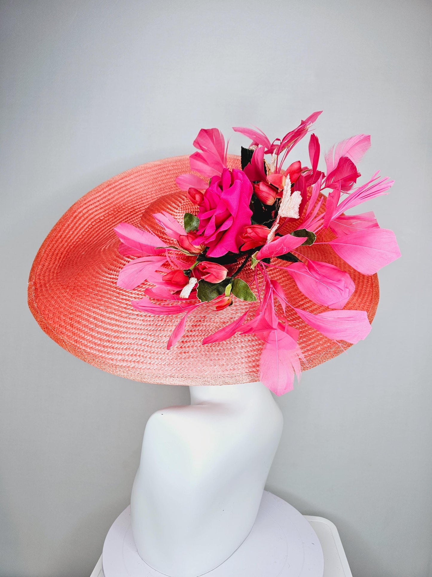 kentucky derby hat wide brim straw in coral orange with pink branching feathers hot pink satin roses green light pink gold leaves