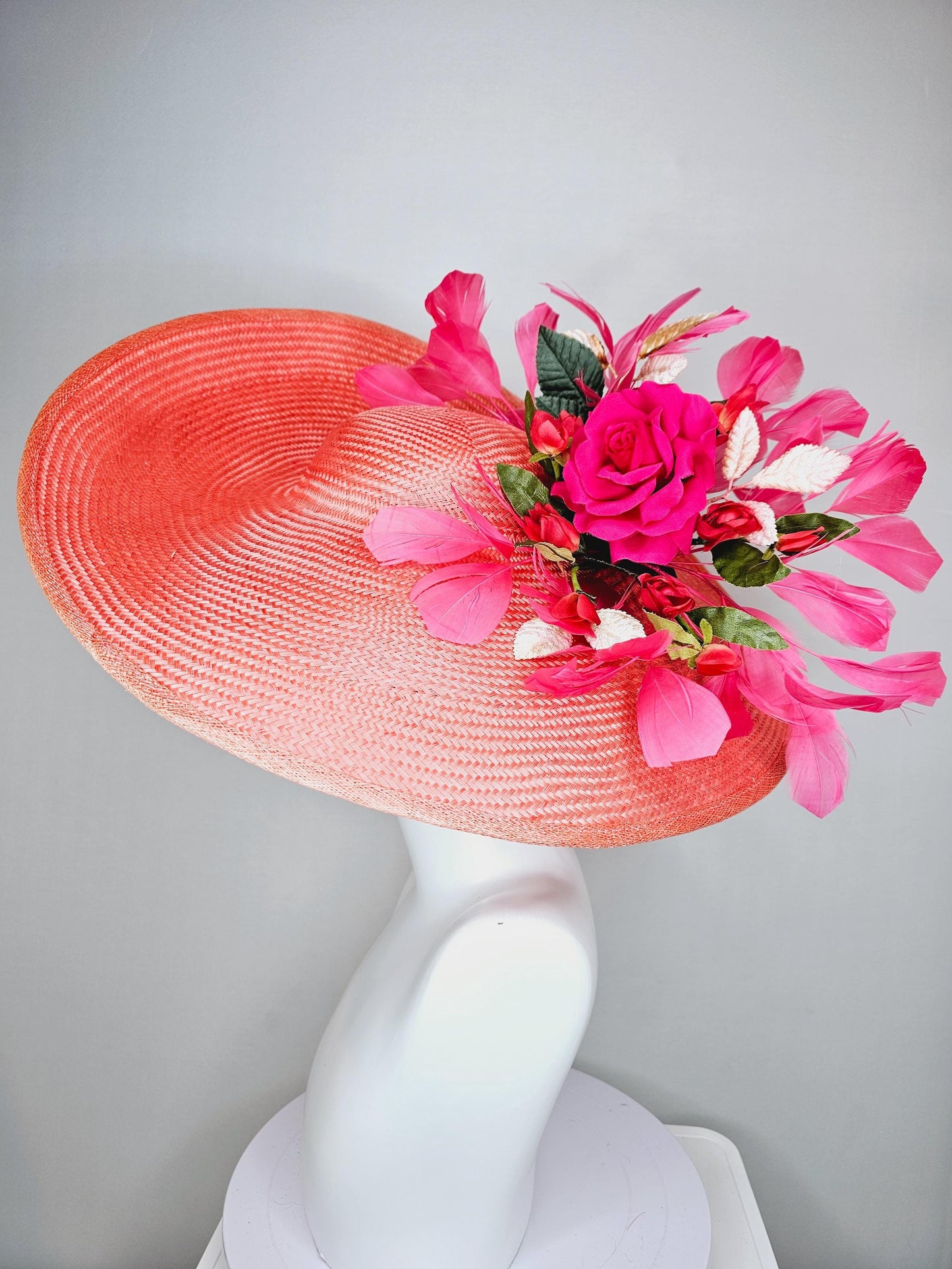 kentucky derby hat wide brim straw in coral orange with pink branching feathers hot pink satin roses green light pink gold leaves