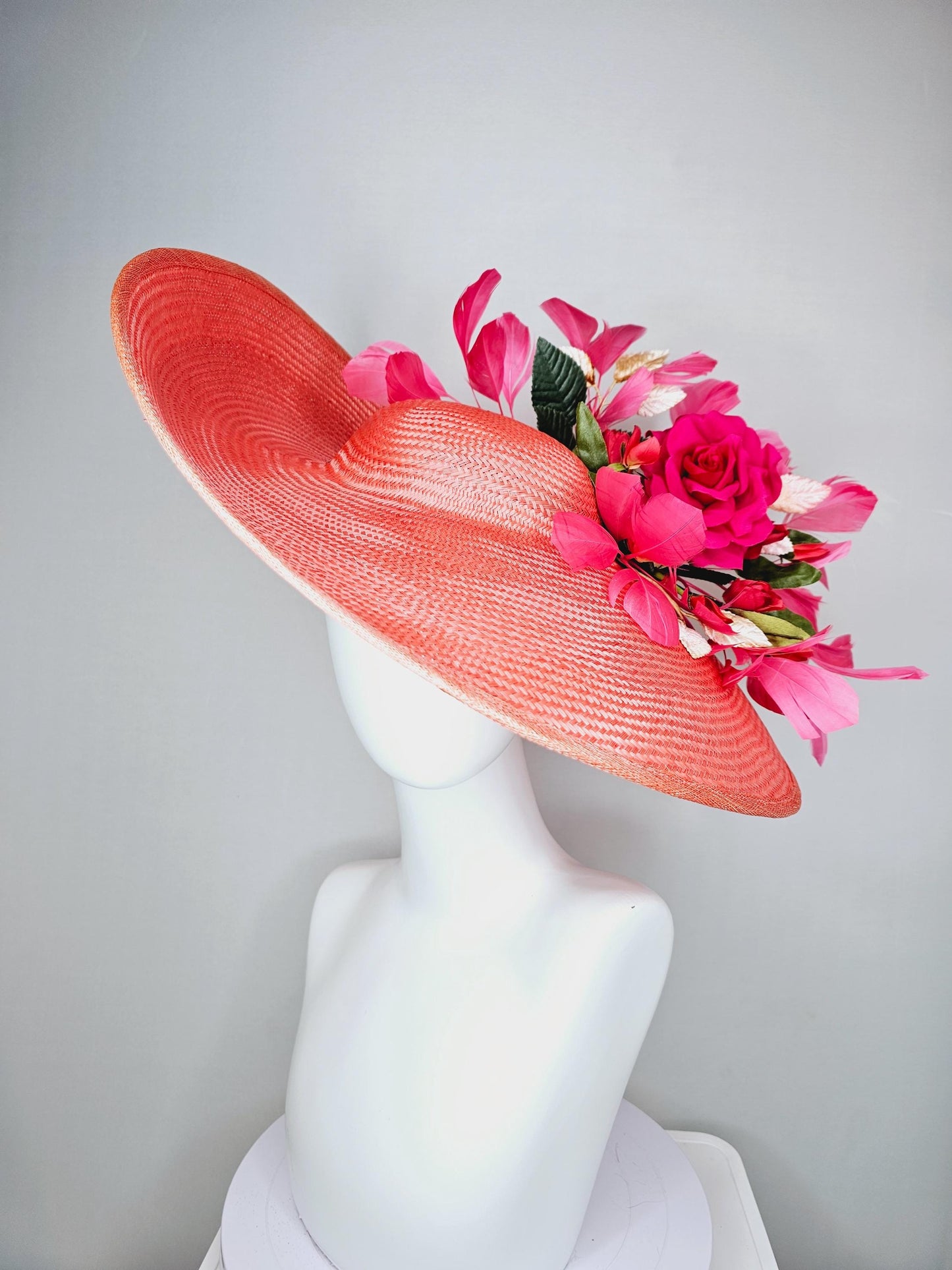 kentucky derby hat wide brim straw in coral orange with pink branching feathers hot pink satin roses green light pink gold leaves