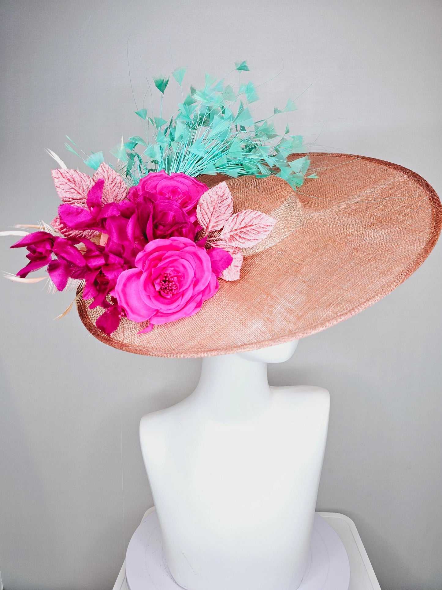 kentucky derby hat wide brim coral orange sinamay with bright fuchsia pink satin roses light pink leaves mint green neutral beige feathers