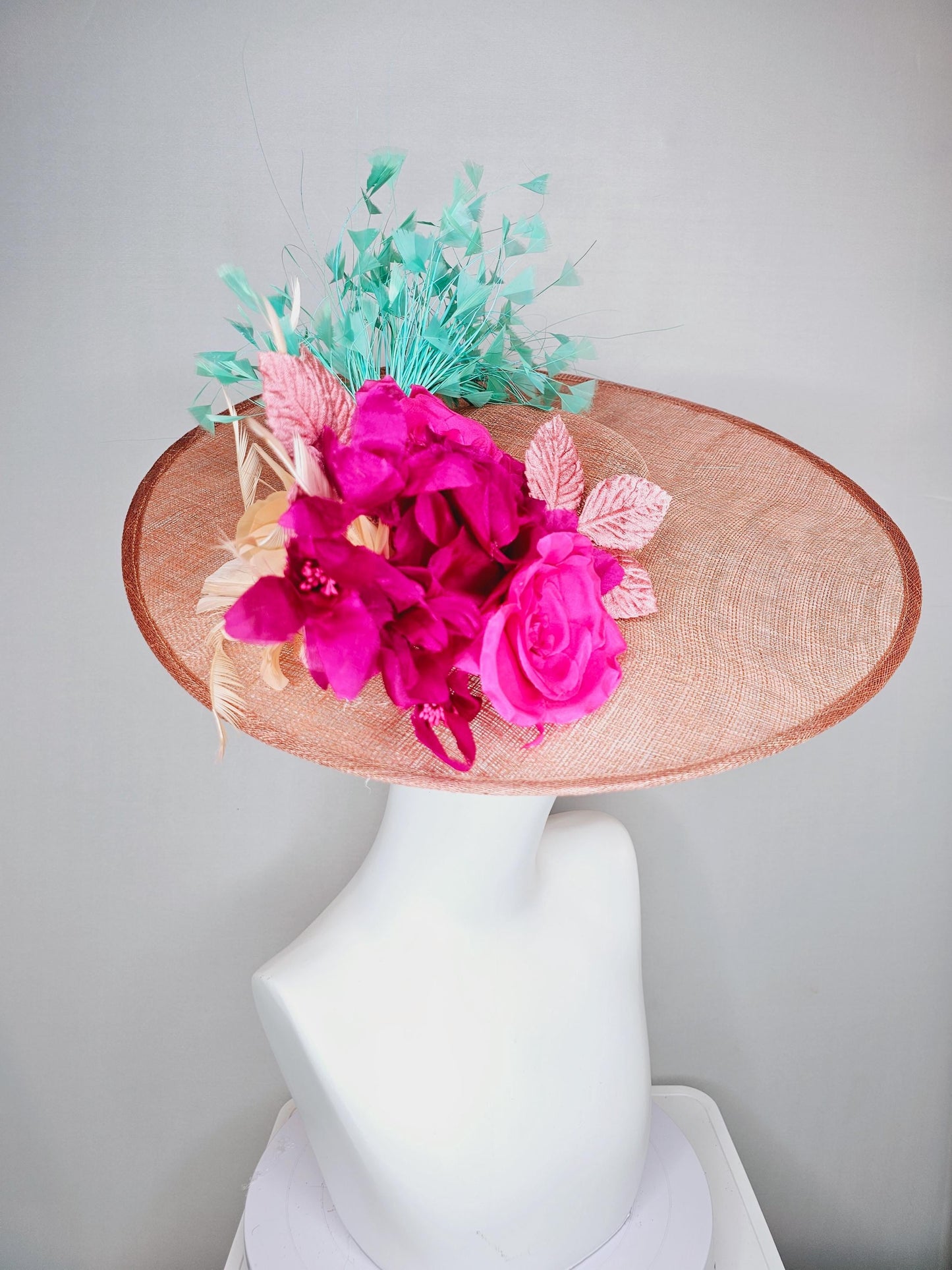 kentucky derby hat wide brim coral orange sinamay with bright fuchsia pink satin roses light pink leaves mint green neutral beige feathers
