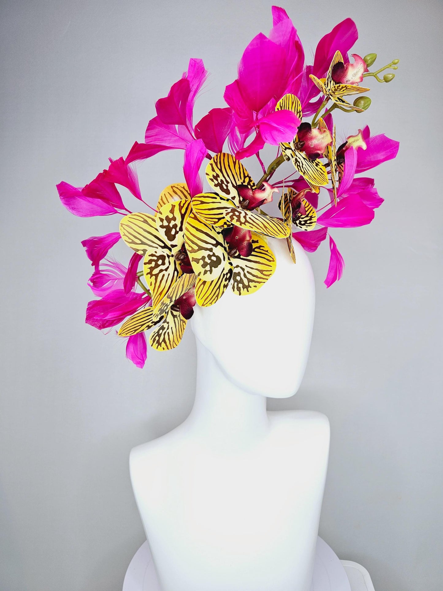 kentucky derby hat fascinator large yellow black and burgundy red satin silk orchid flowers with bright fuchsia pink branching feathers