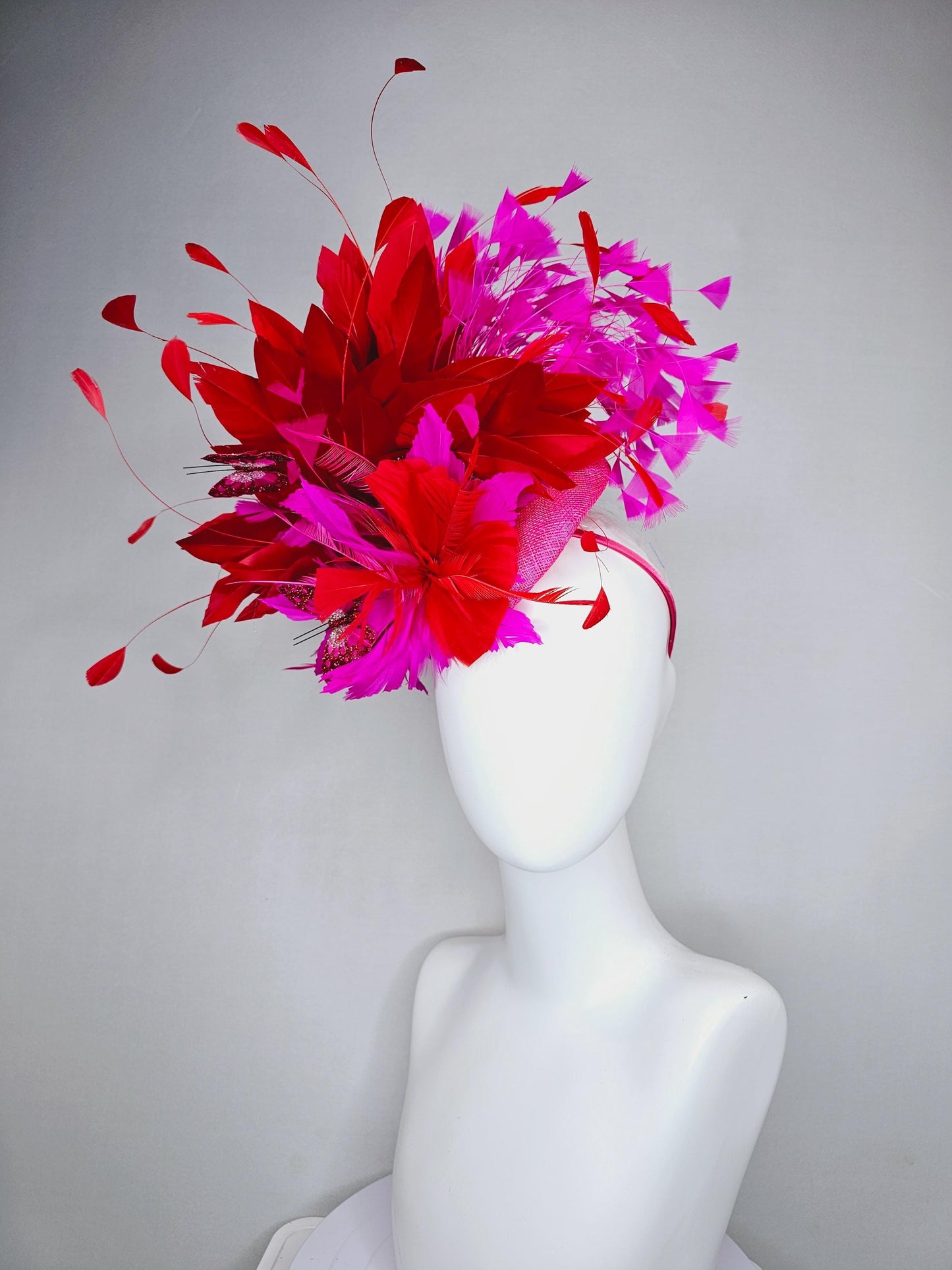 kentucky derby hat fascinator pink sinamay with scarlet red and fuchsia pink zigzag feather flower red pink feathers red pink butterflies