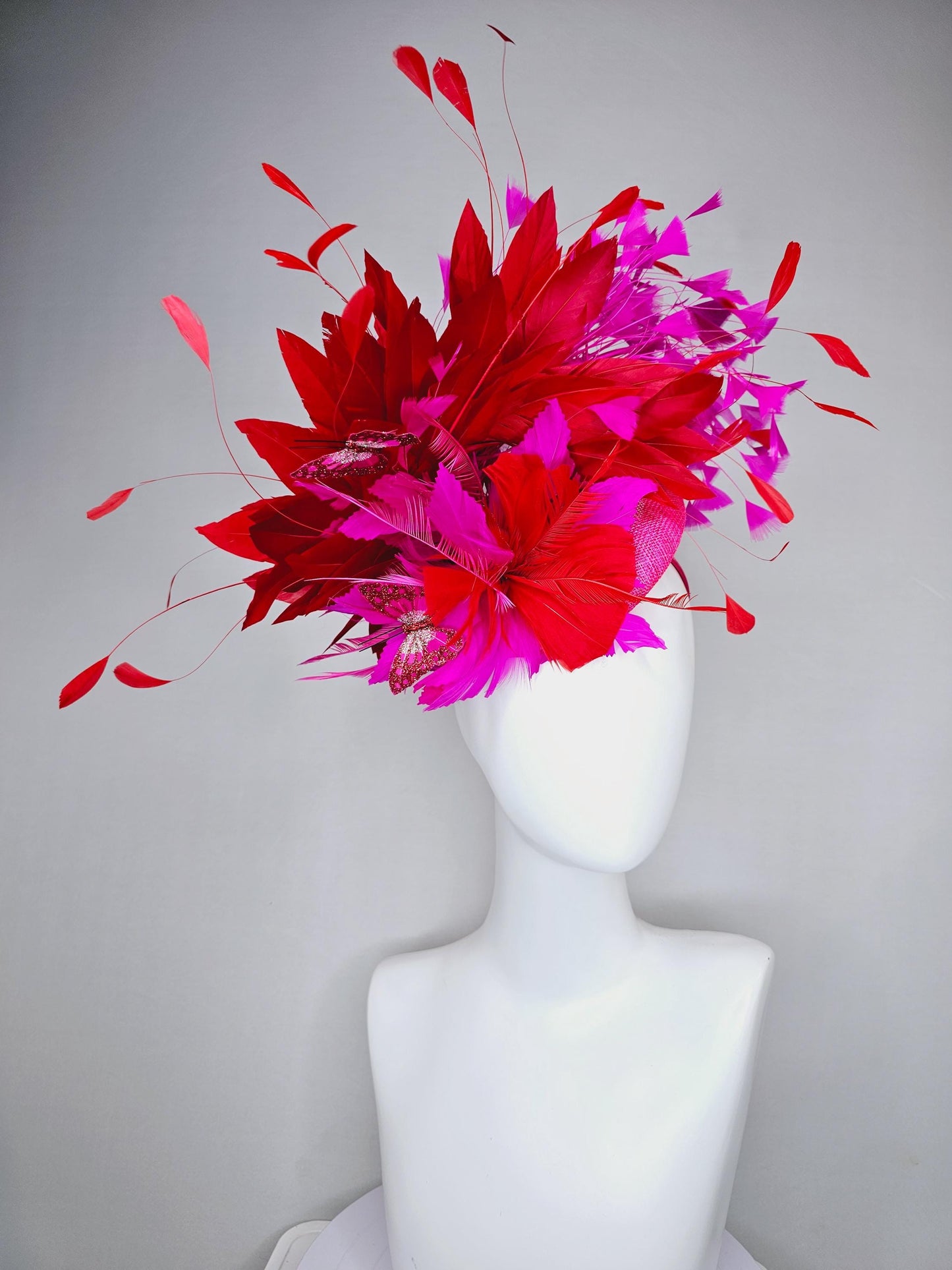 kentucky derby hat fascinator pink sinamay with scarlet red and fuchsia pink zigzag feather flower red pink feathers red pink butterflies