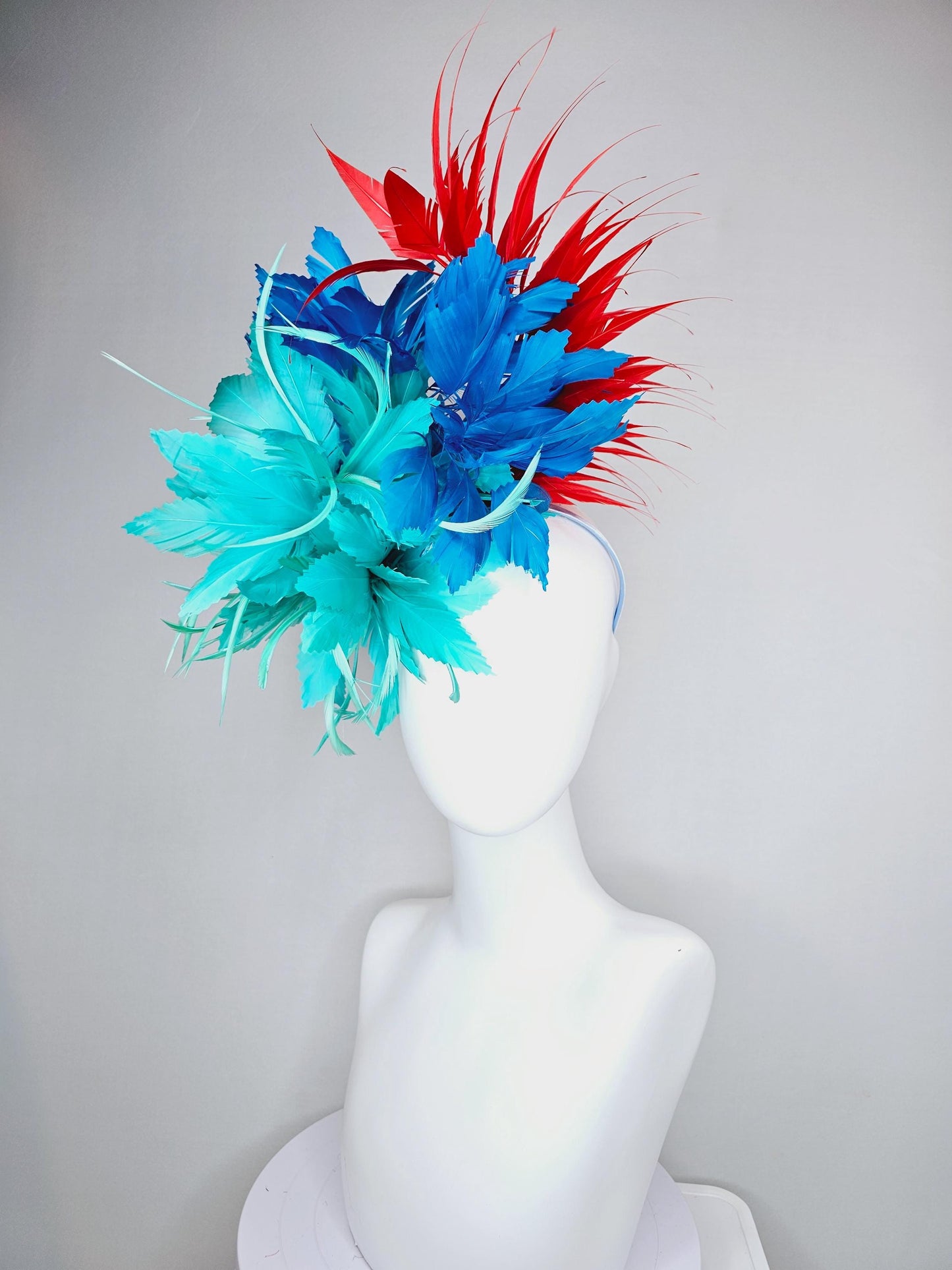 kentucky derby hat fascinator with fluffy aqua blue mint green cobalt blue zigzag feather flowers and red branching feathers