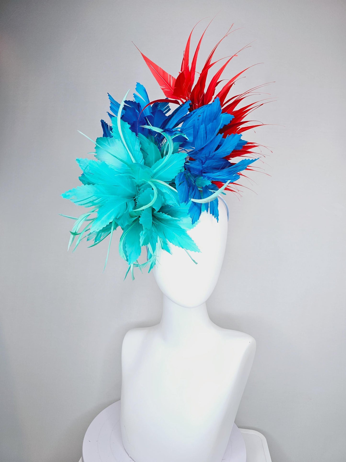 kentucky derby hat fascinator with fluffy aqua blue mint green cobalt blue zigzag feather flowers and red branching feathers