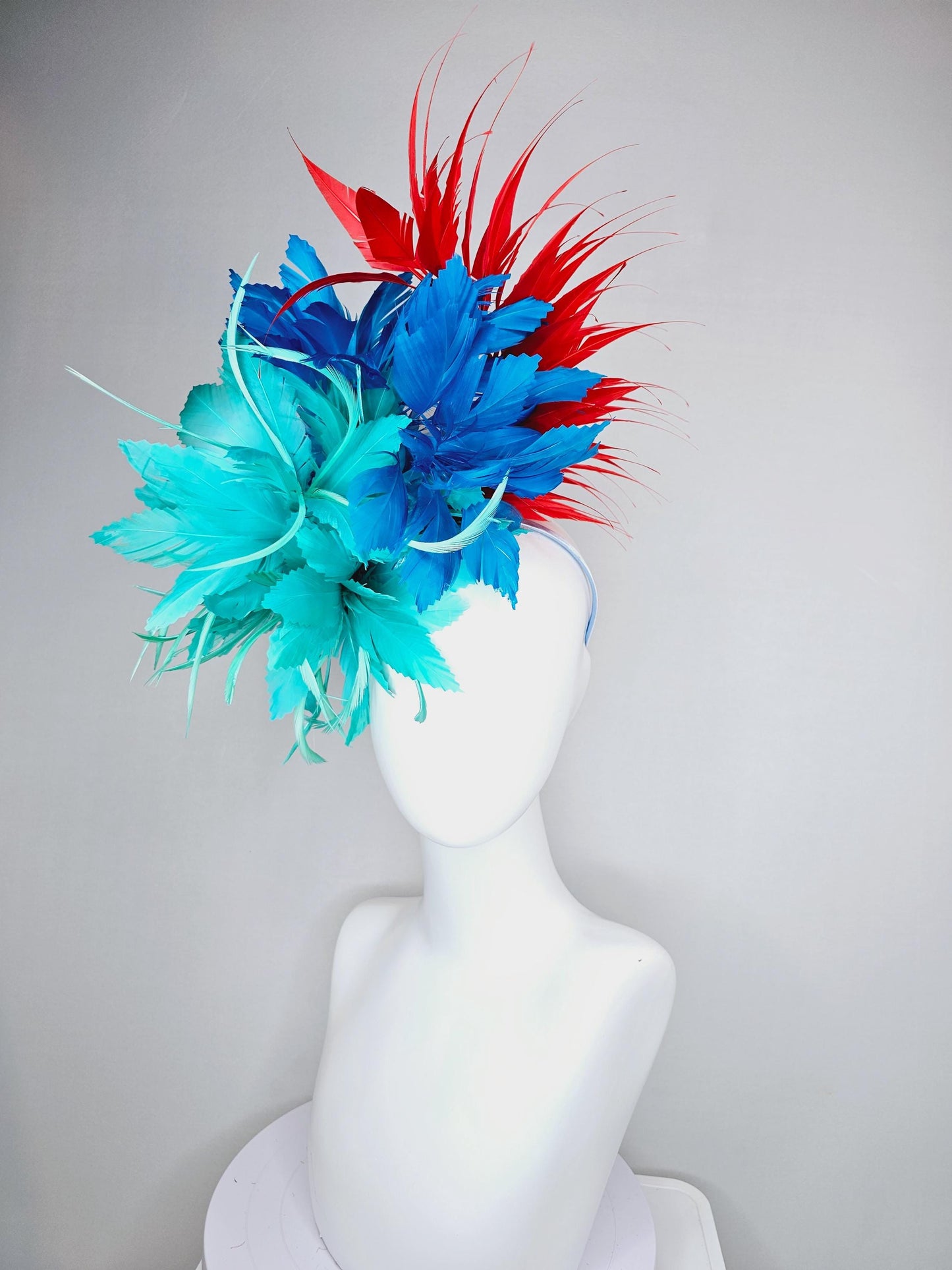 kentucky derby hat fascinator with fluffy aqua blue mint green cobalt blue zigzag feather flowers and red branching feathers