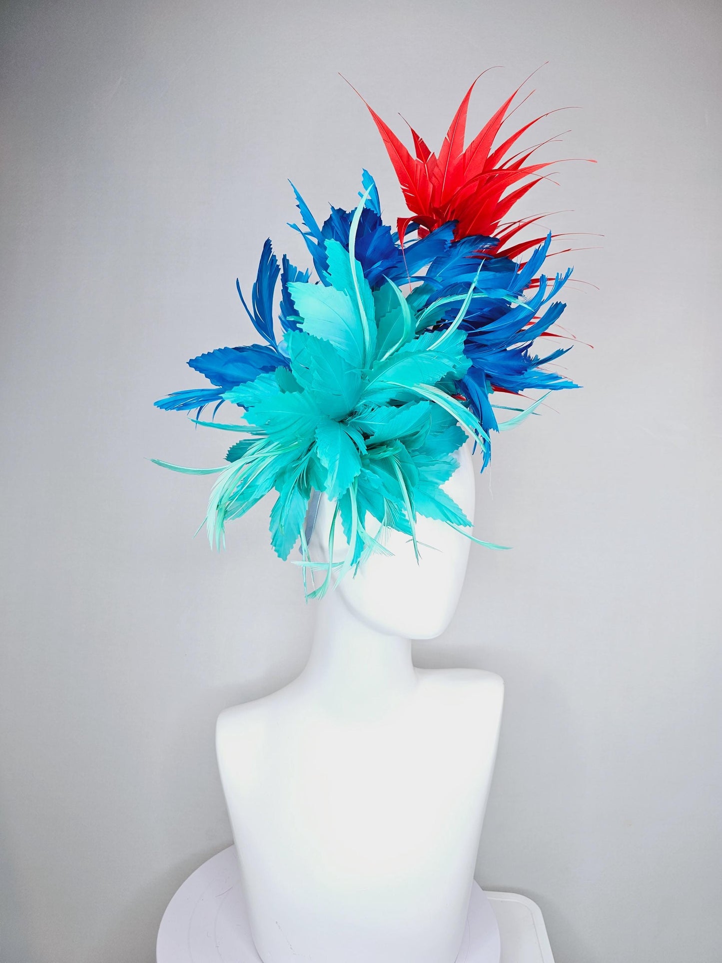 kentucky derby hat fascinator with fluffy aqua blue mint green cobalt blue zigzag feather flowers and red branching feathers