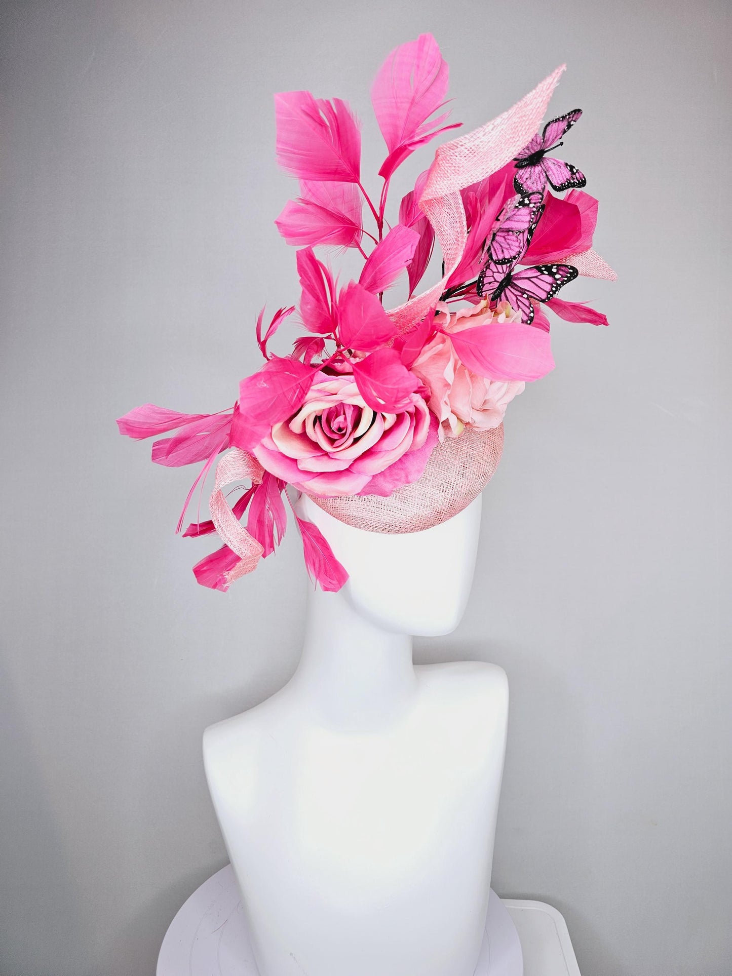 kentucky derby hat fascinator blush pink sinamay with sinamay curls, pink blush pink satin roses, pink feathers, pink and black butterflies