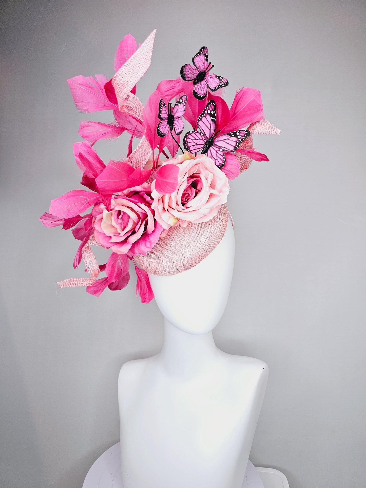 kentucky derby hat fascinator blush pink sinamay with sinamay curls, pink blush pink satin roses, pink feathers, pink and black butterflies