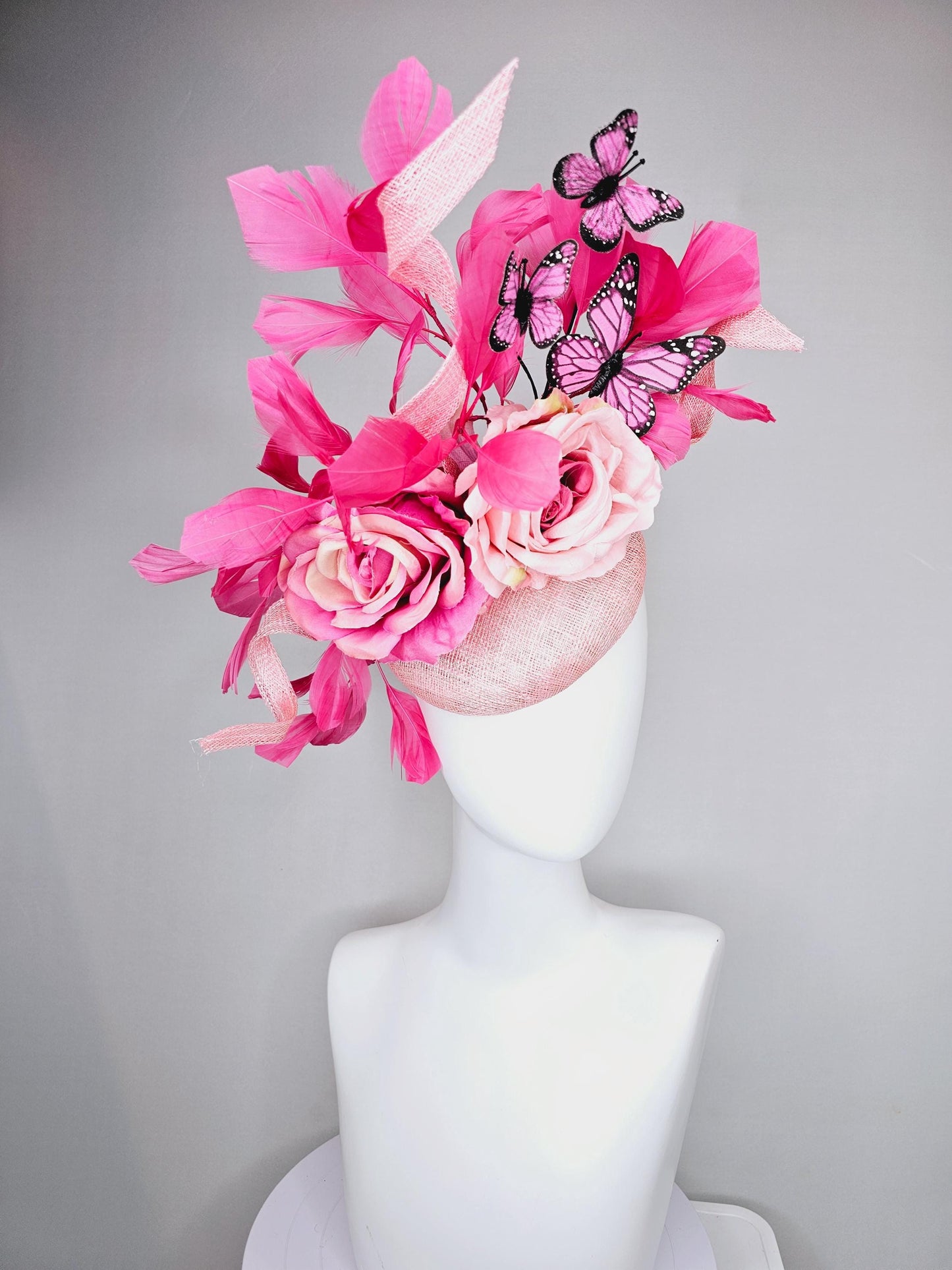 kentucky derby hat fascinator blush pink sinamay with sinamay curls, pink blush pink satin roses, pink feathers, pink and black butterflies