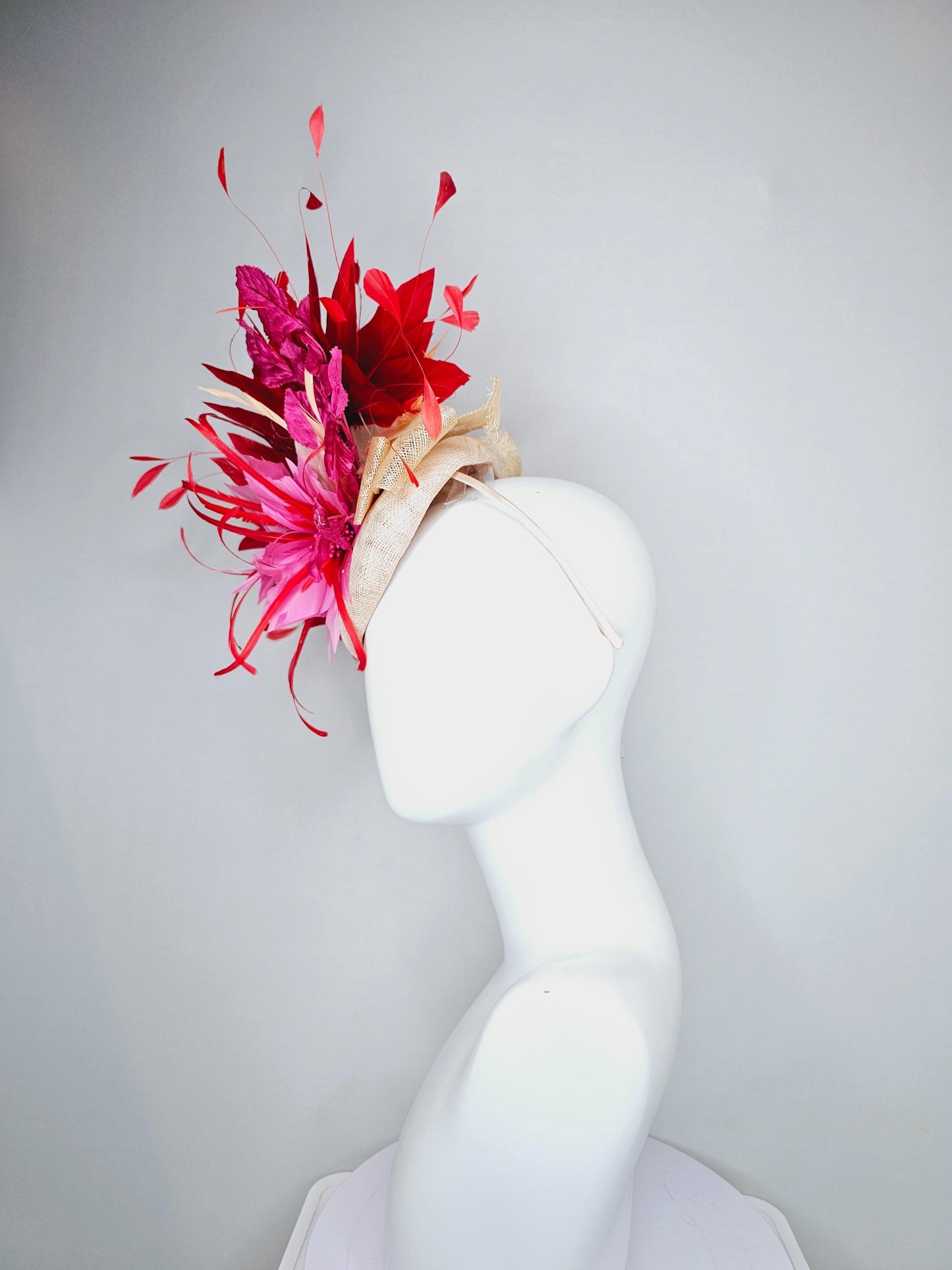 kentucky derby hat fascinator neutral beige sinamay with blush pink beige feather flower, bright pink leaves, scarlet red branching feathers