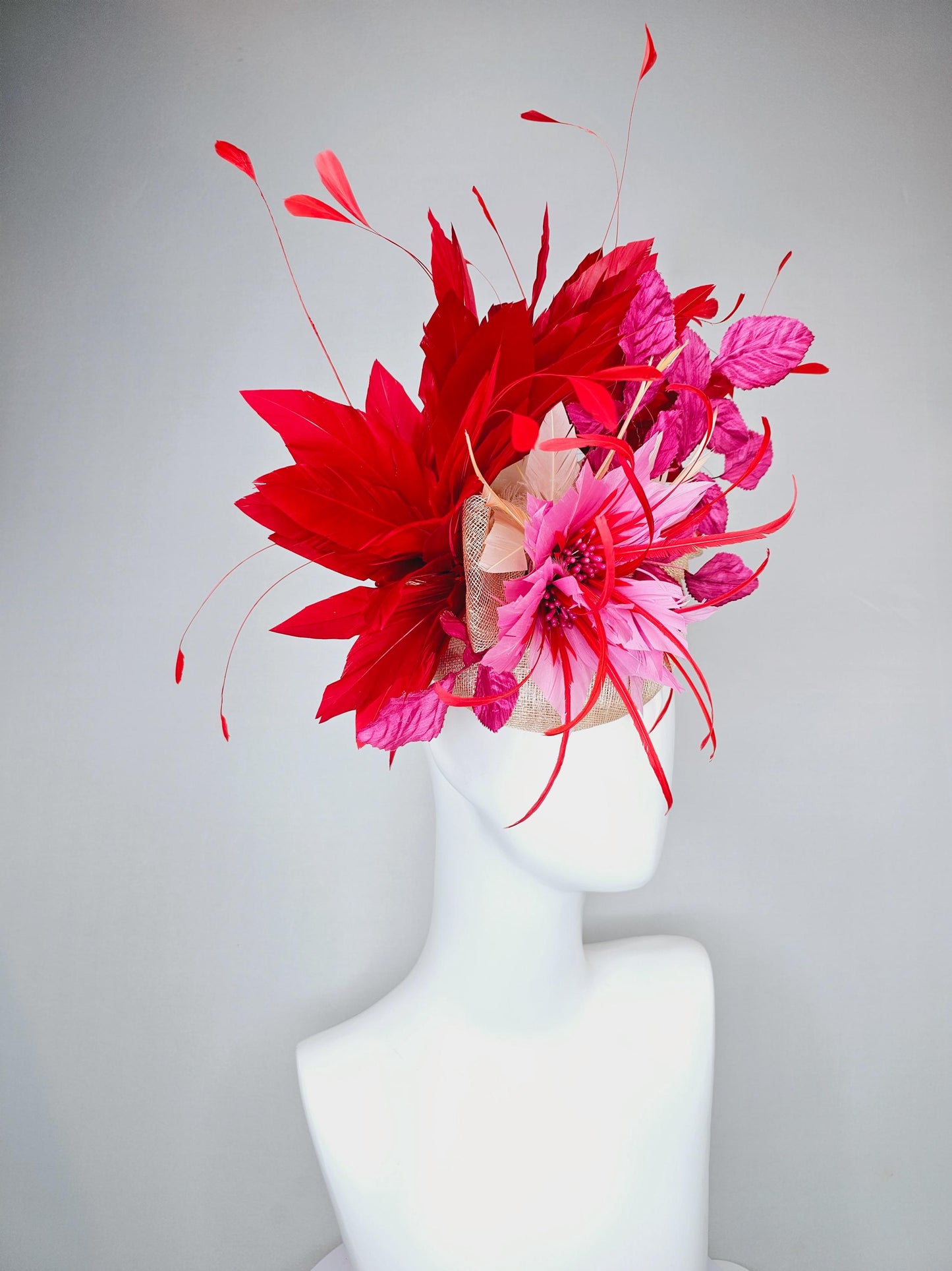 kentucky derby hat fascinator neutral beige sinamay with blush pink beige feather flower, bright pink leaves, scarlet red branching feathers