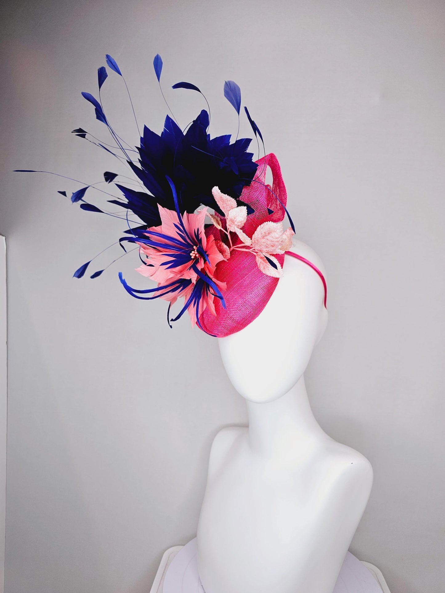 kentucky derby hat fascinator raspberry pink sinamay with peach pink and royal blue feather flower,peach leaves,navy blue branching feathers