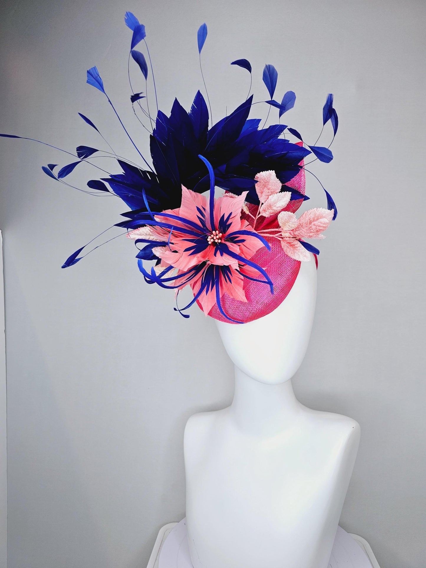 kentucky derby hat fascinator raspberry pink sinamay with peach pink and royal blue feather flower,peach leaves,navy blue branching feathers