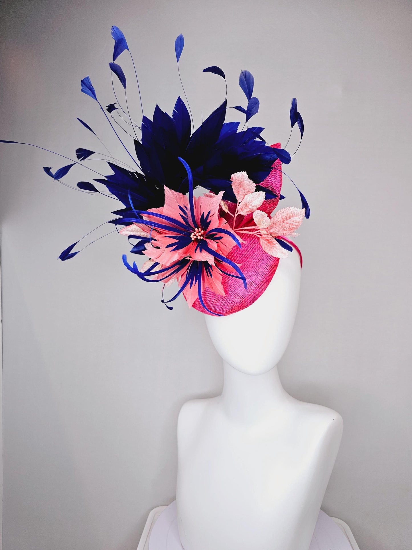 kentucky derby hat fascinator raspberry pink sinamay with peach pink and royal blue feather flower,peach leaves,navy blue branching feathers