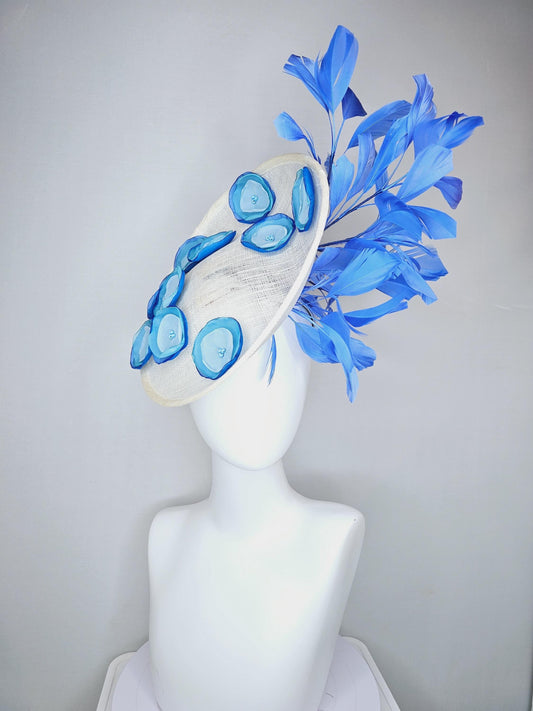 kentucky derby hat fascinator white sinamay saucer with light blue sky blue cobalt blue organza silk flowers, cobalt blue branching feathers