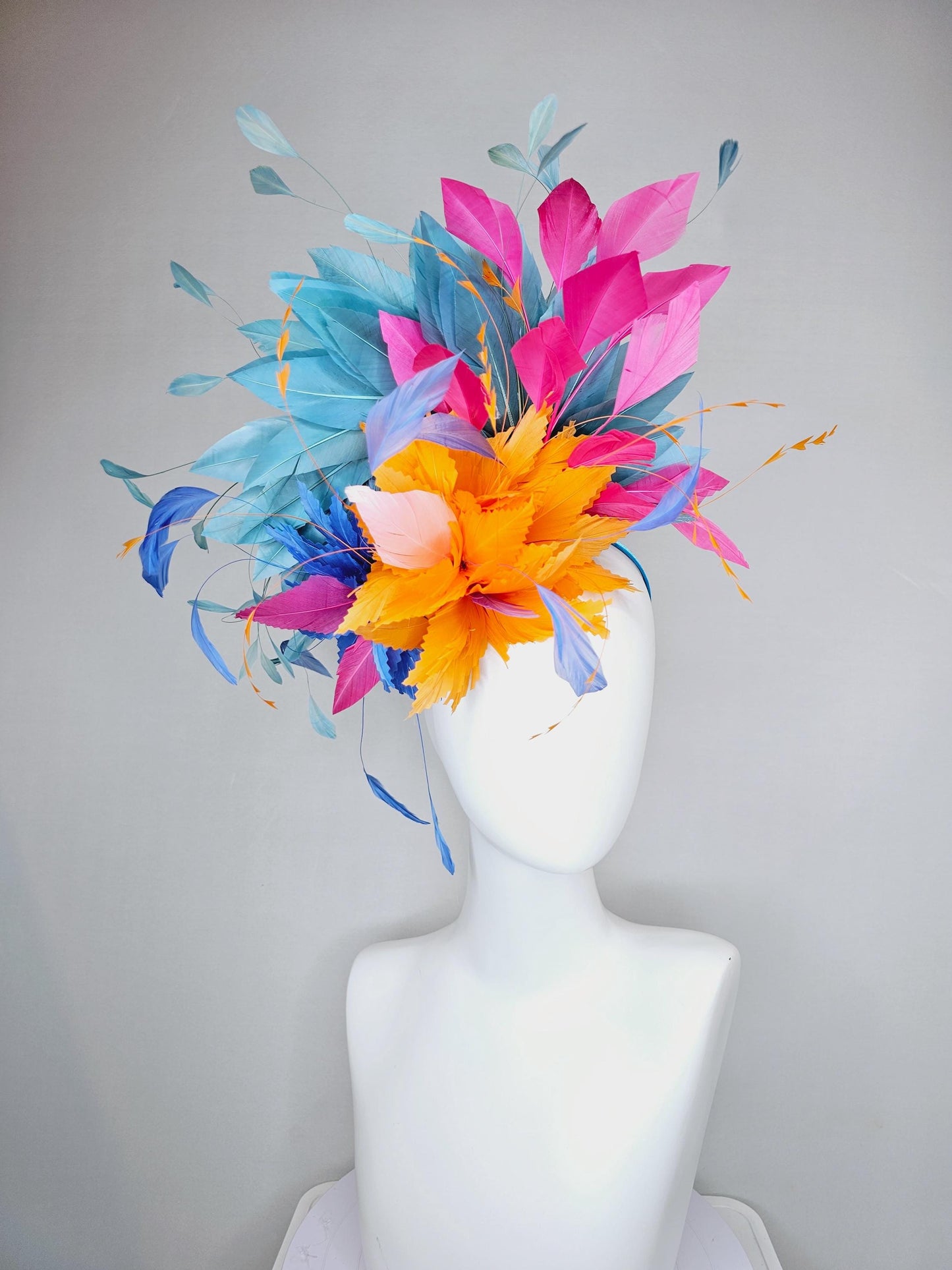 kentucky derby hat fascinator tangerine orange feather flower with colorful pink,blue teal,and cobalt blue branching feathers