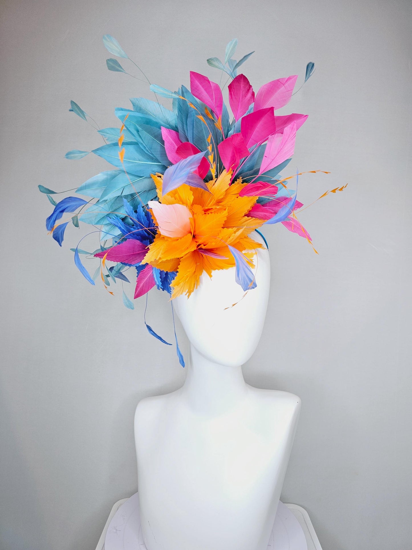 kentucky derby hat fascinator tangerine orange feather flower with colorful pink,blue teal,and cobalt blue branching feathers