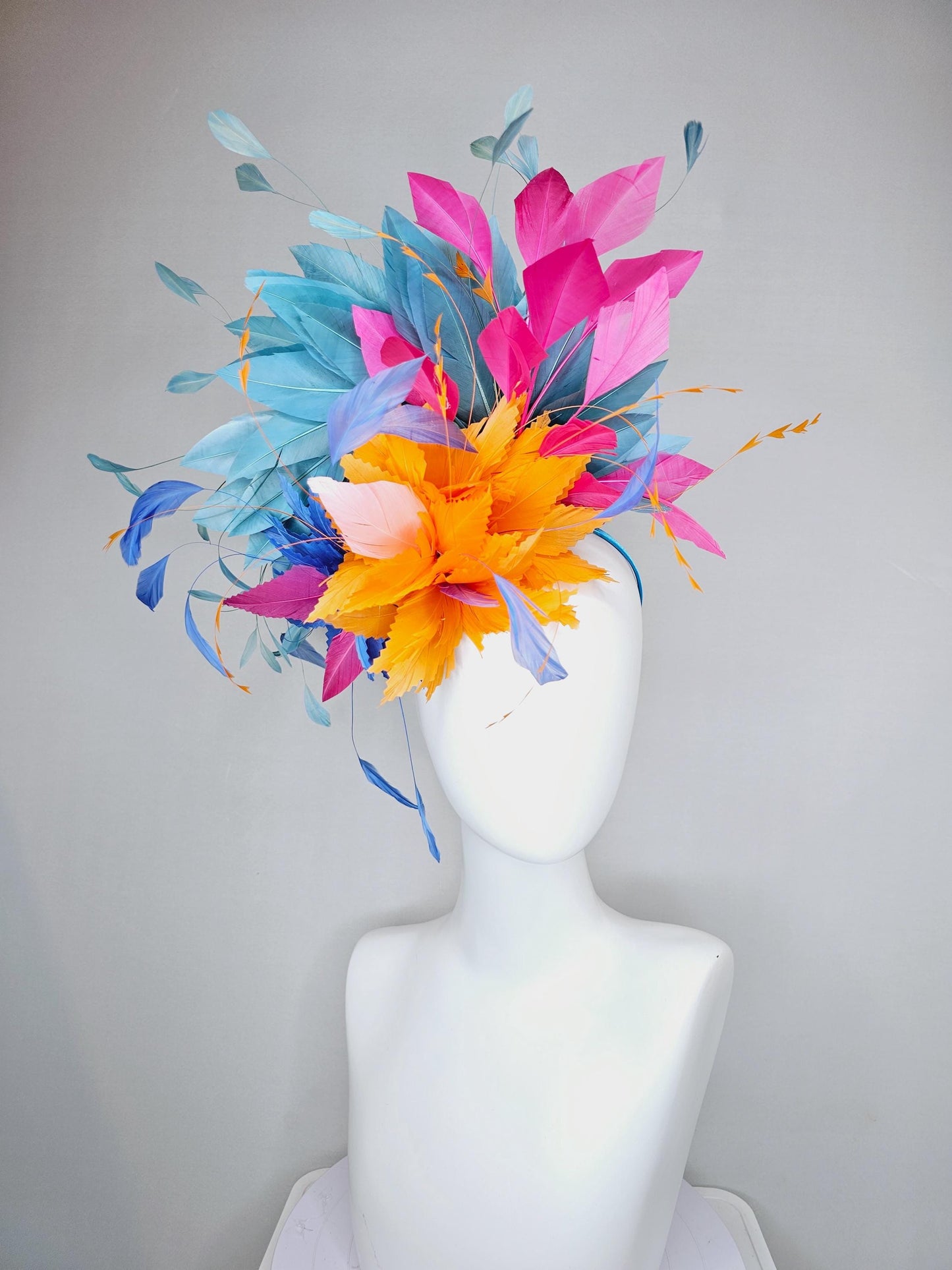 kentucky derby hat fascinator tangerine orange feather flower with colorful pink,blue teal,and cobalt blue branching feathers